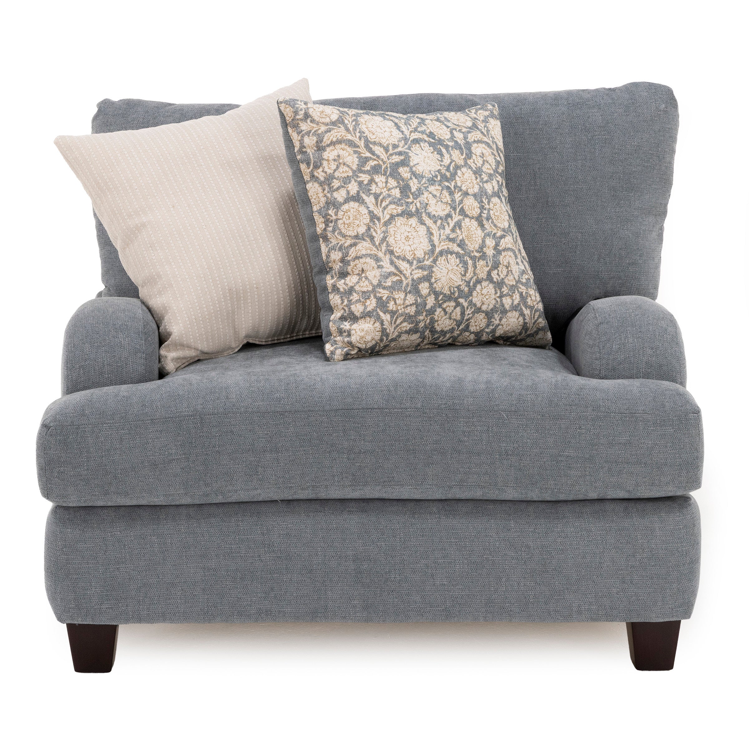Blue upholstered chair with two decorative pillows.