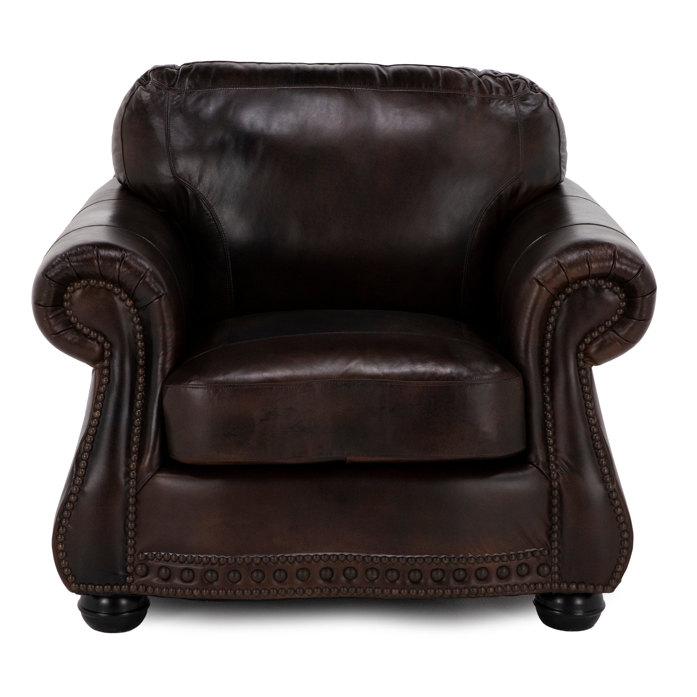 Dark brown leather armchair with rolled arms and nailhead trim.