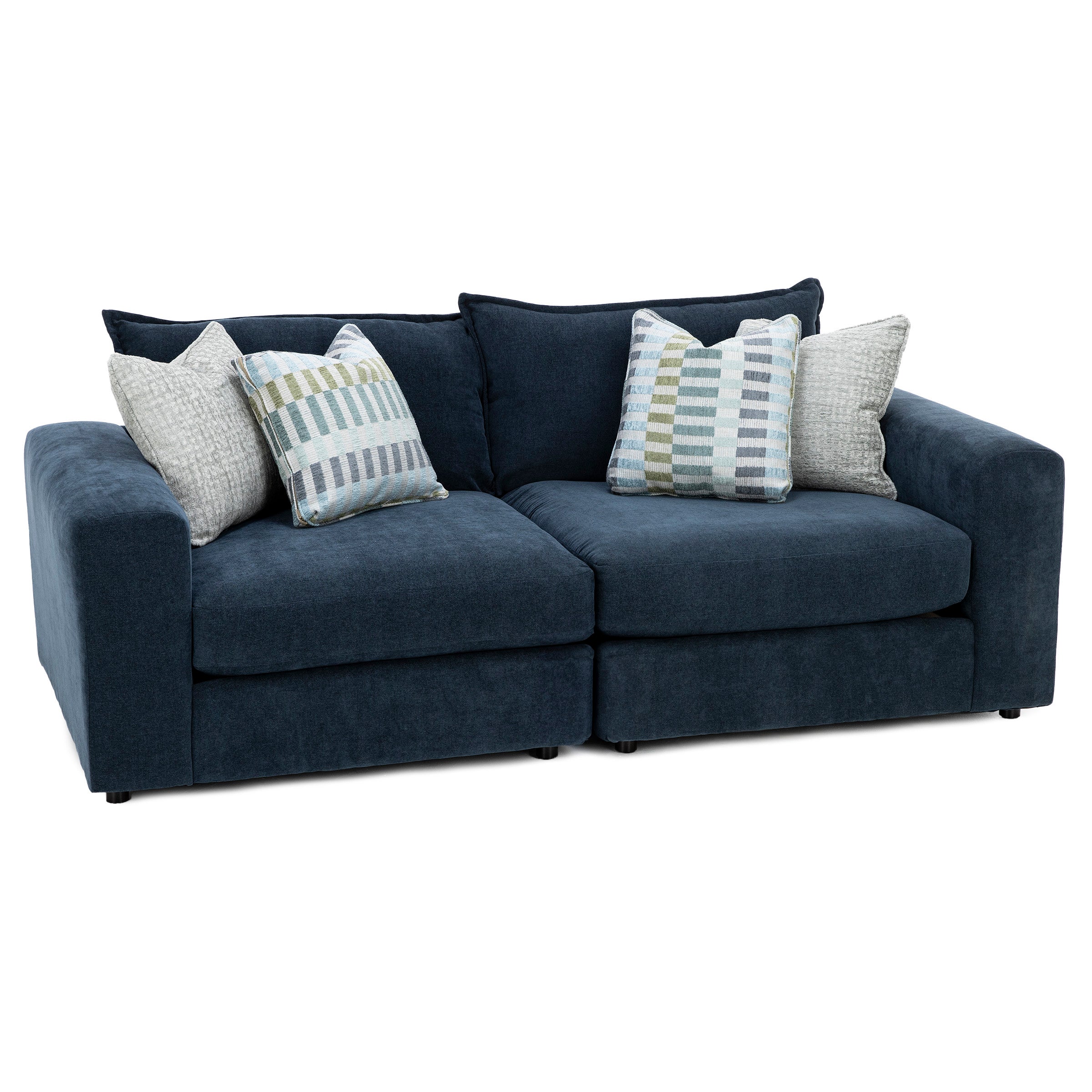 Dark blue sofa with four decorative pillows.