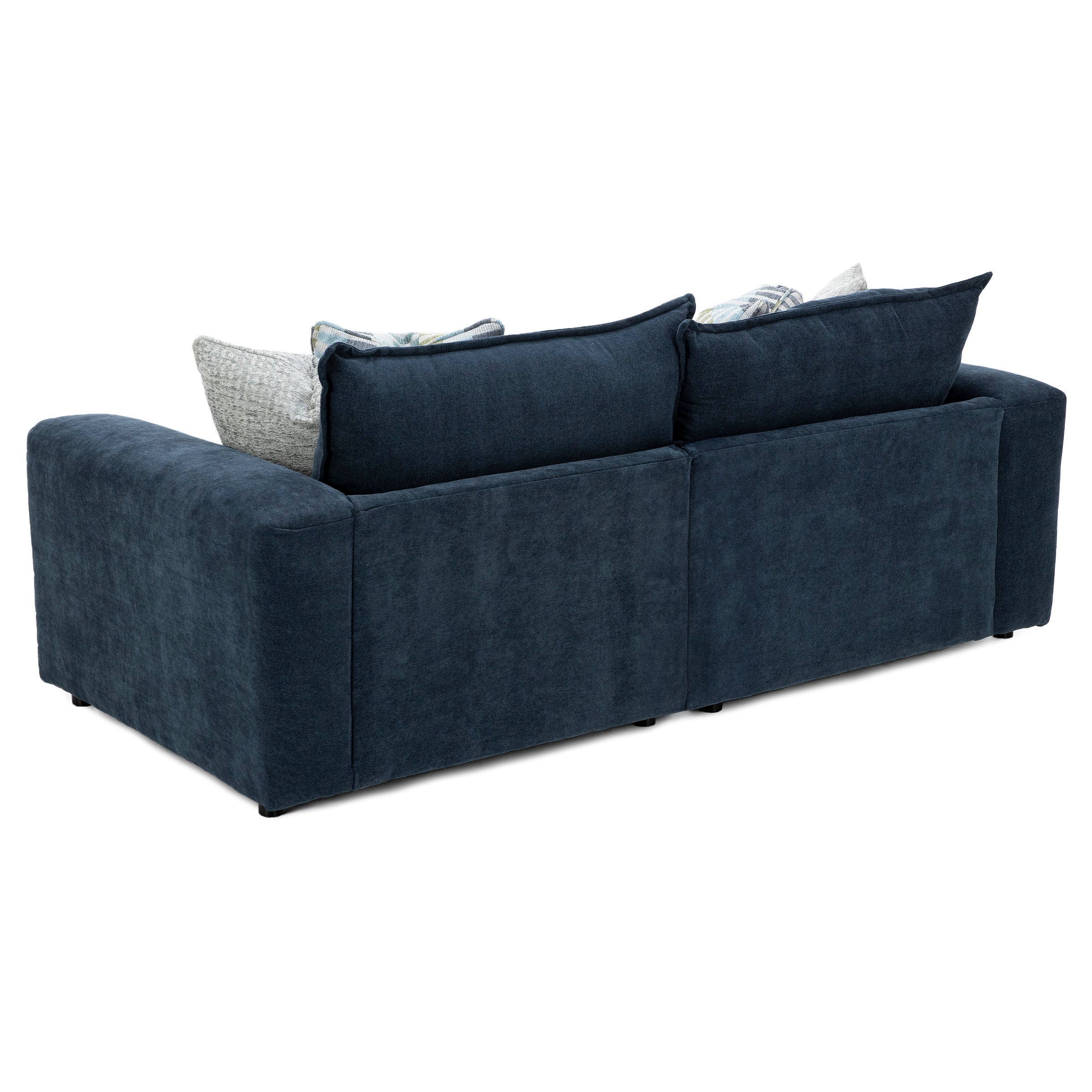 Back view of a dark blue upholstered sofa with large cushions.