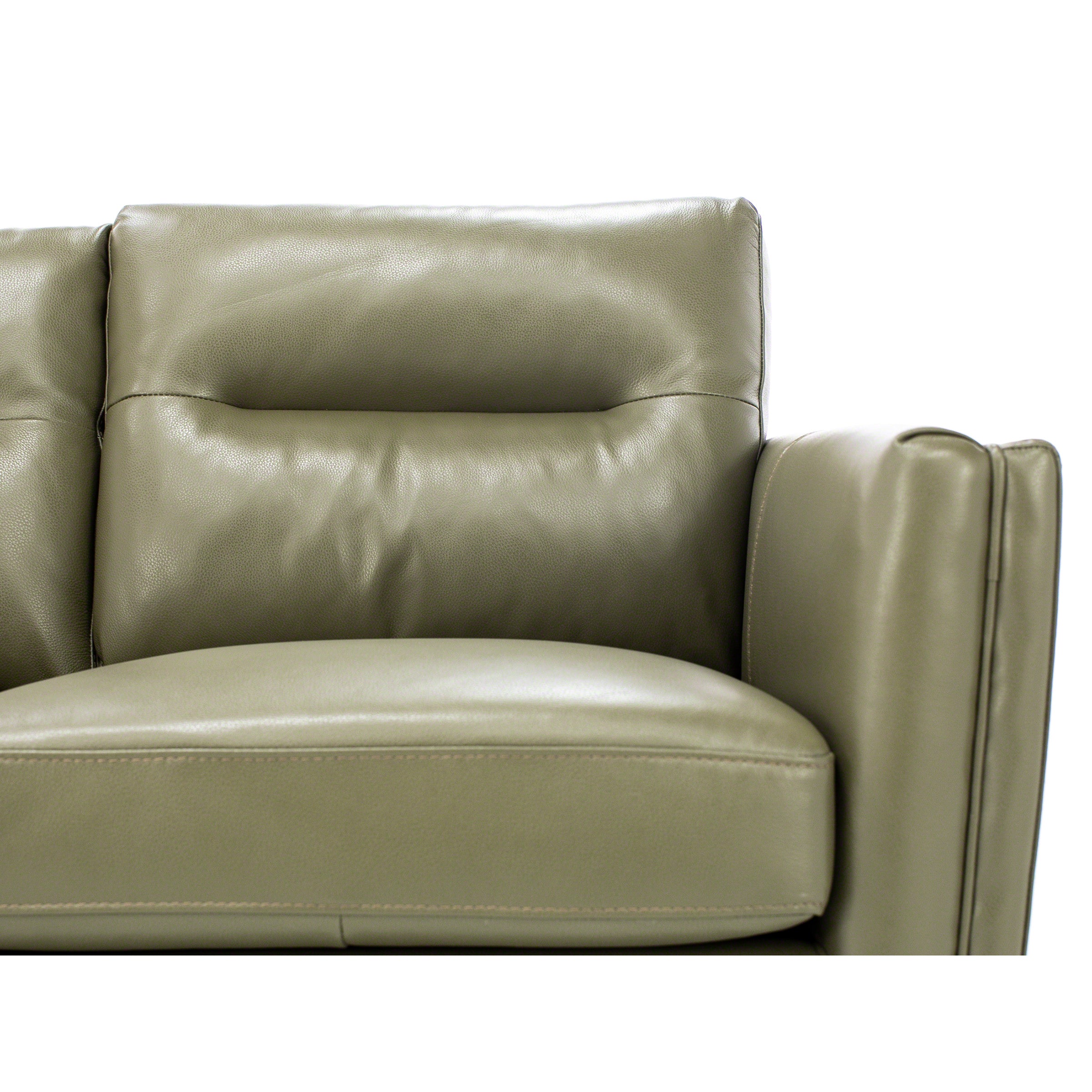 Close-up of a light olive leather sofa showing seat, back, and armrest details.