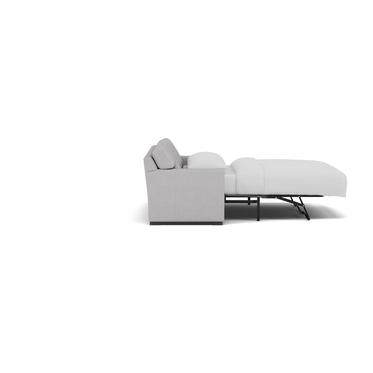 Side view of a light gray sleeper sofa fully extended as a bed with white bedding.