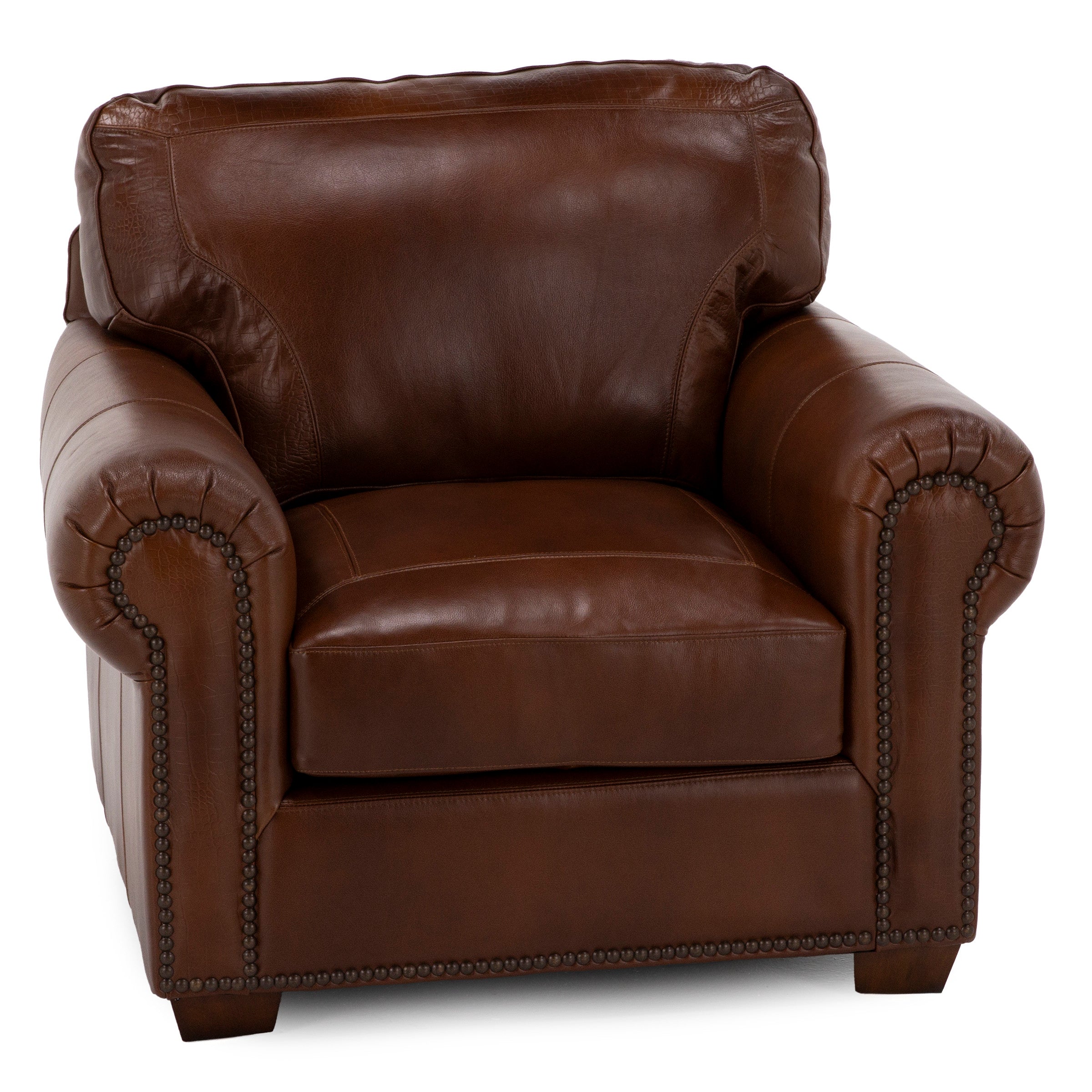 Brown leather armchair with rolled arms and nailhead trim.