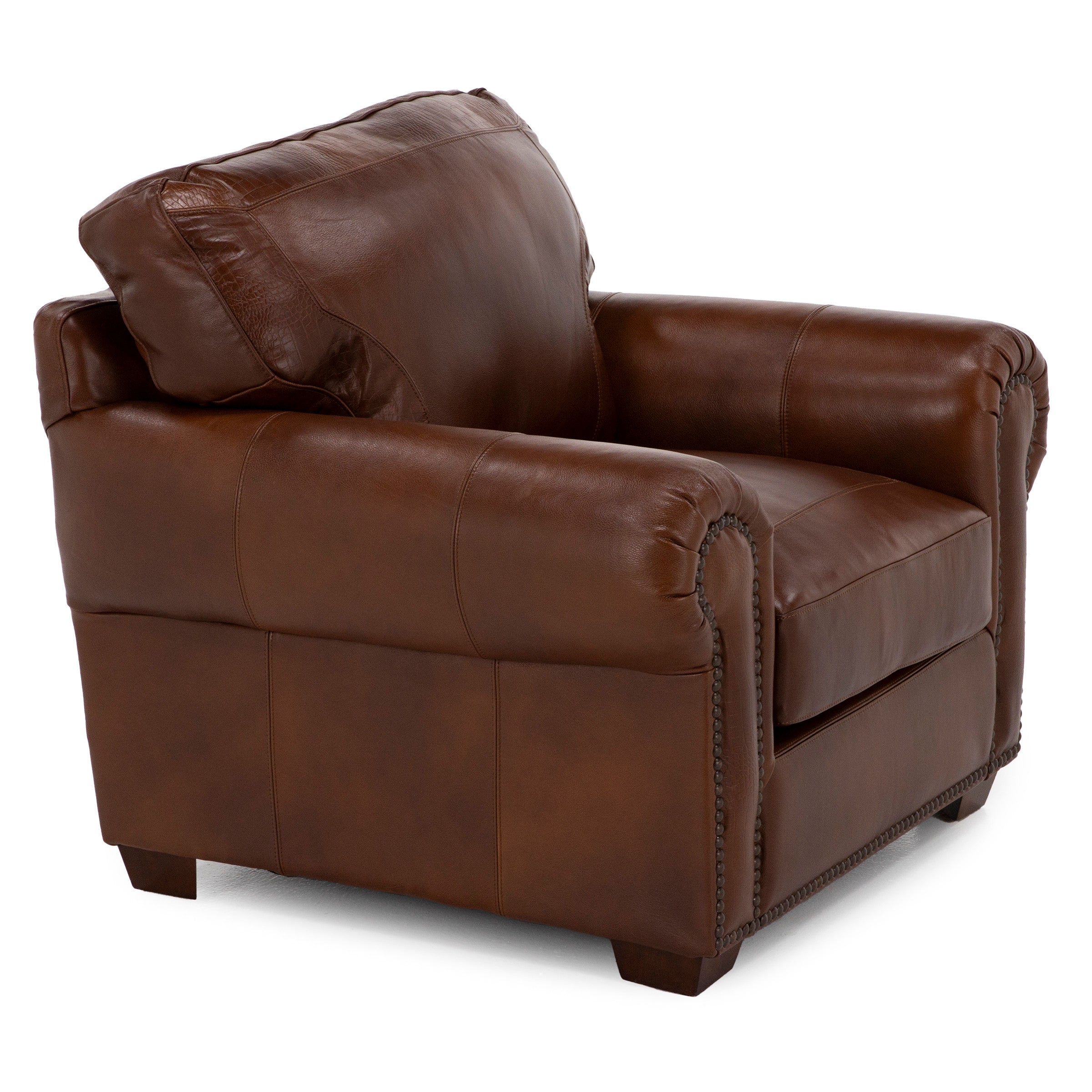 Brown leather armchair with rolled arms and nailhead trim.