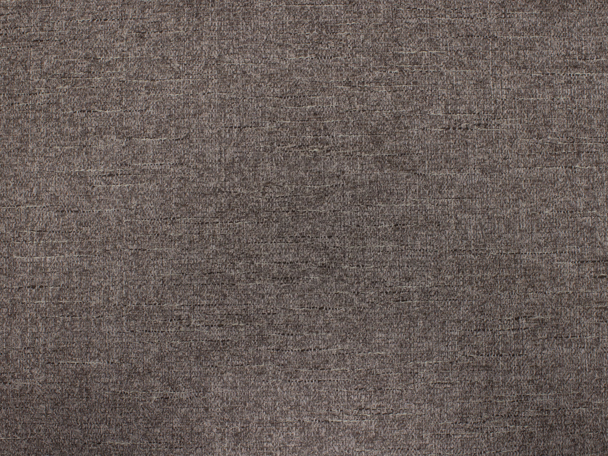 Close-up of textured brown fabric, suitable for upholstery or home decor.