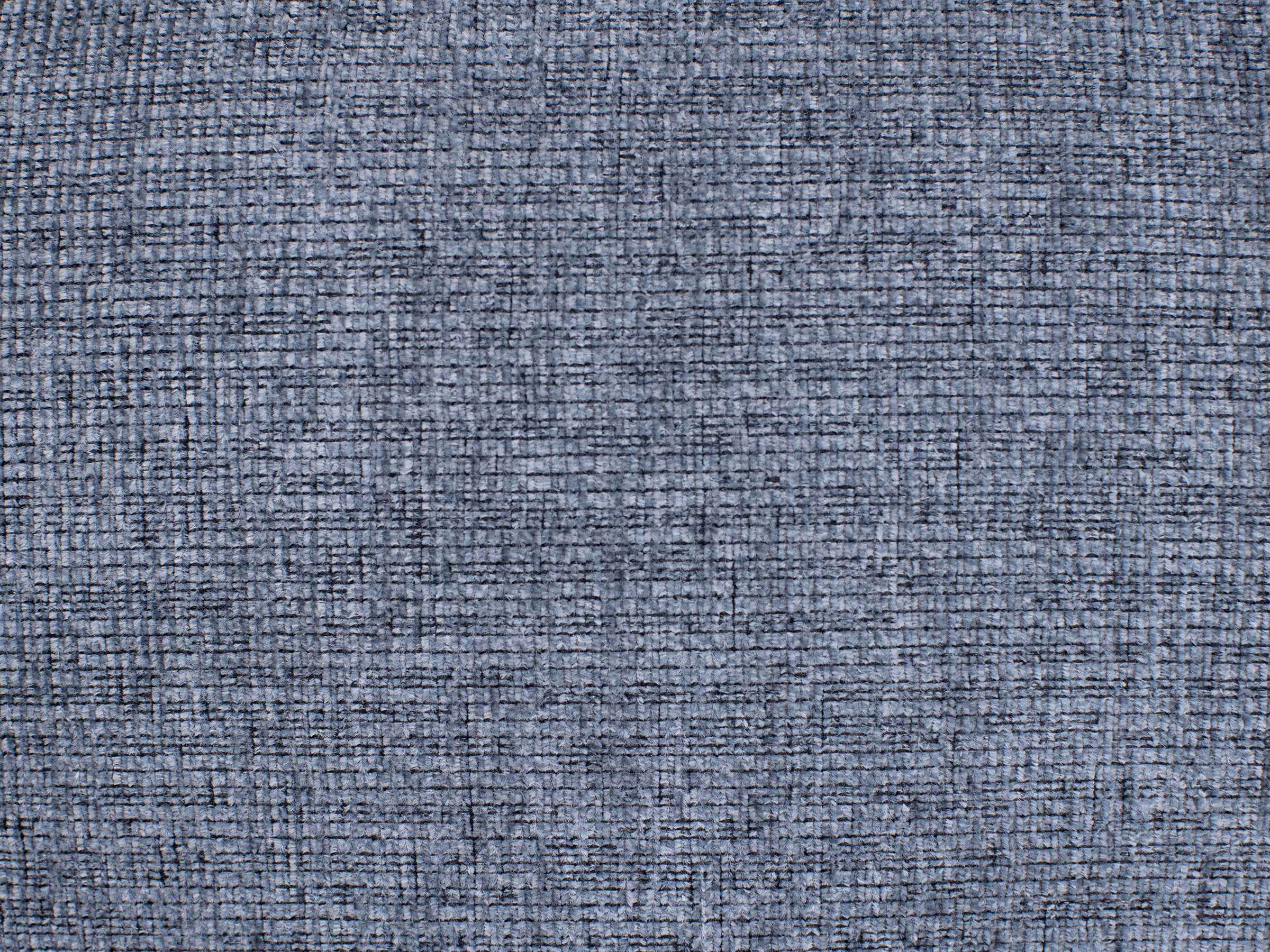 Blue textured fabric with a grid-like woven pattern