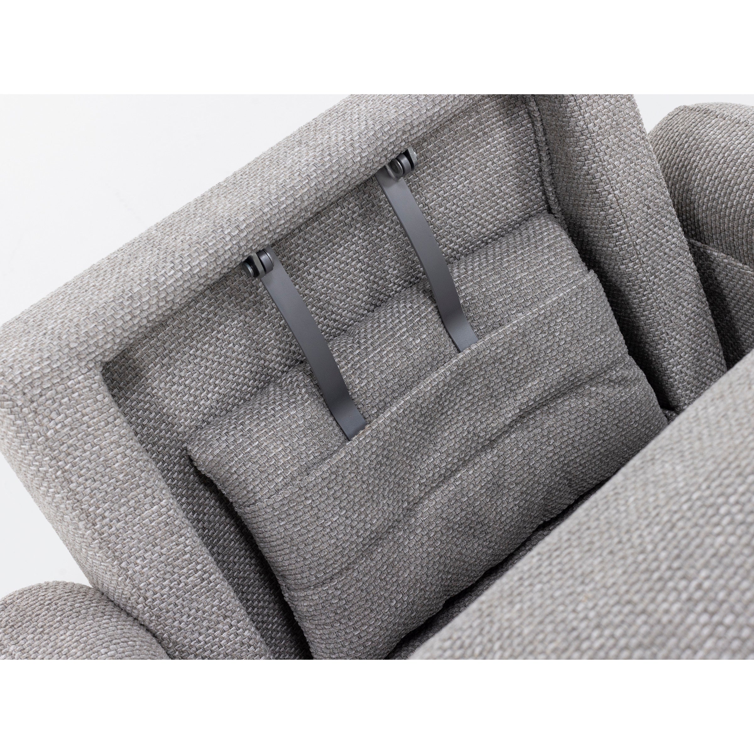 Close-up of adjustable headrest with gray fabric and metal support straps.