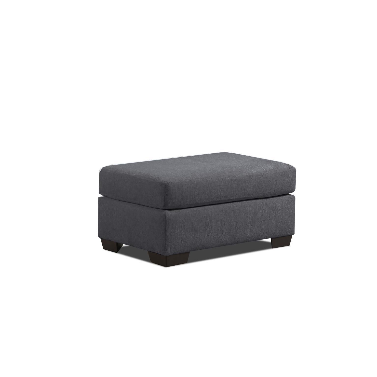 Dark gray rectangular ottoman with short legs on a white background.