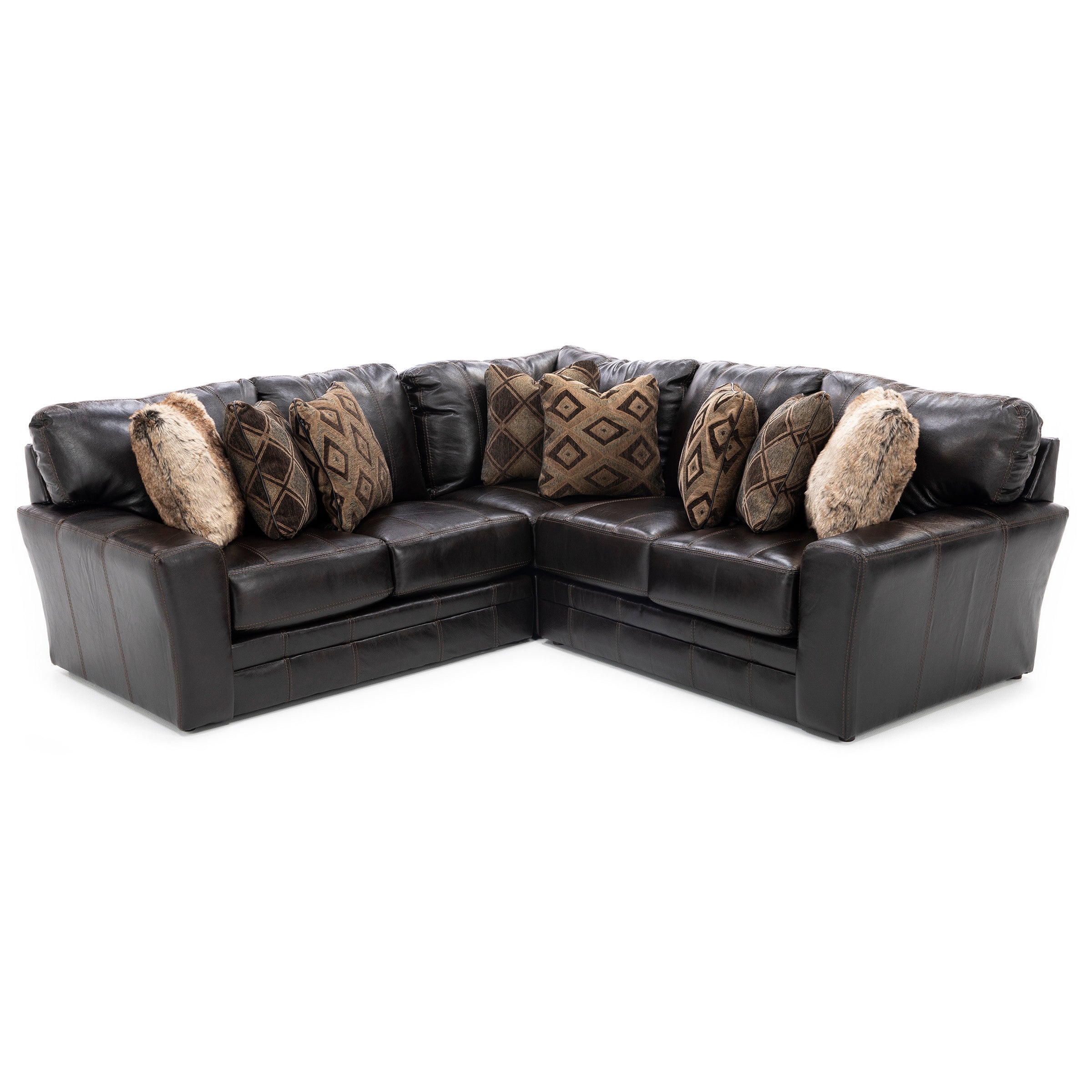 Dark brown leather sectional sofa with patterned and faux fur throw pillows.