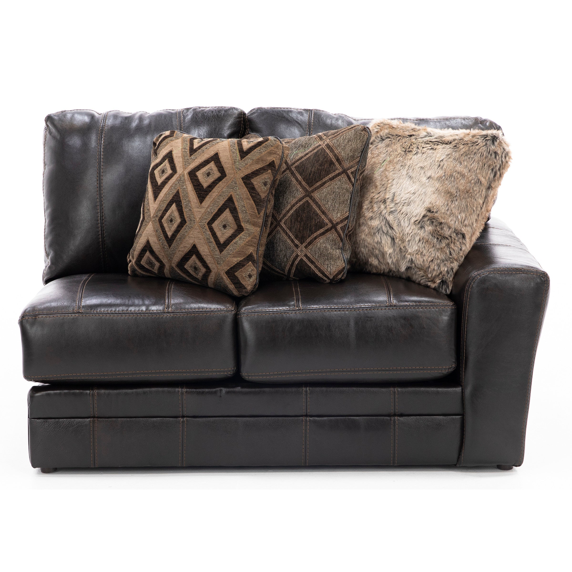 Dark brown leather sofa with three assorted brown pillows.
