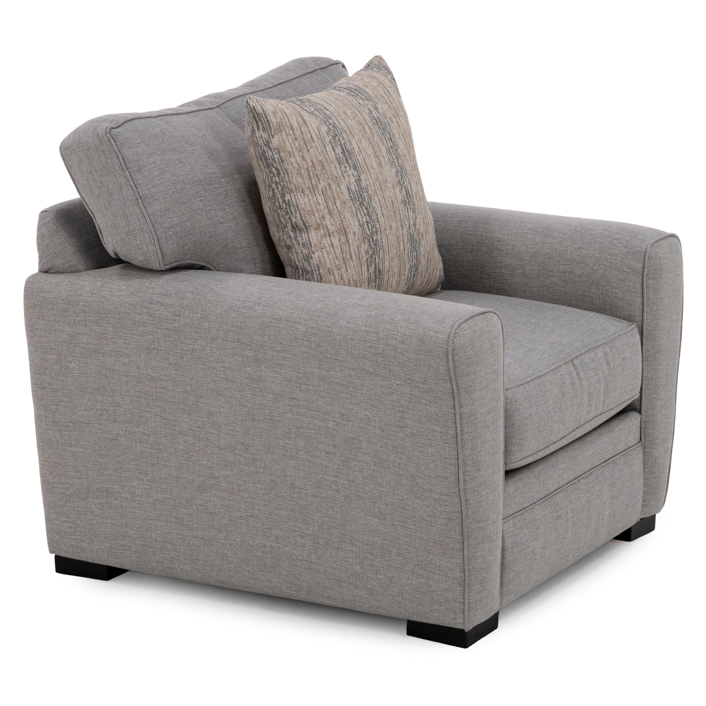 Modern gray fabric armchair with a patterned accent pillow.