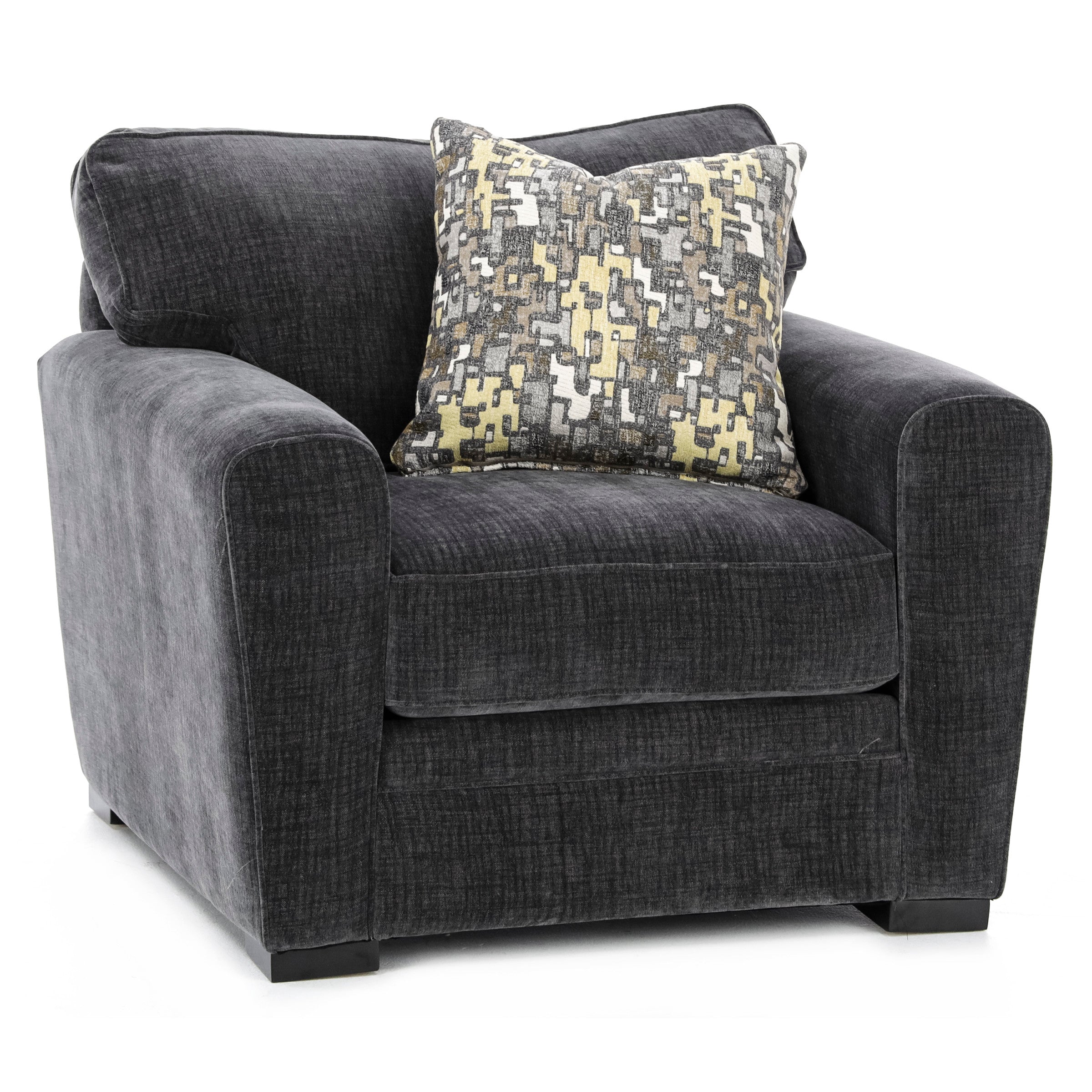 Dark gray armchair with abstract patterned accent pillow.