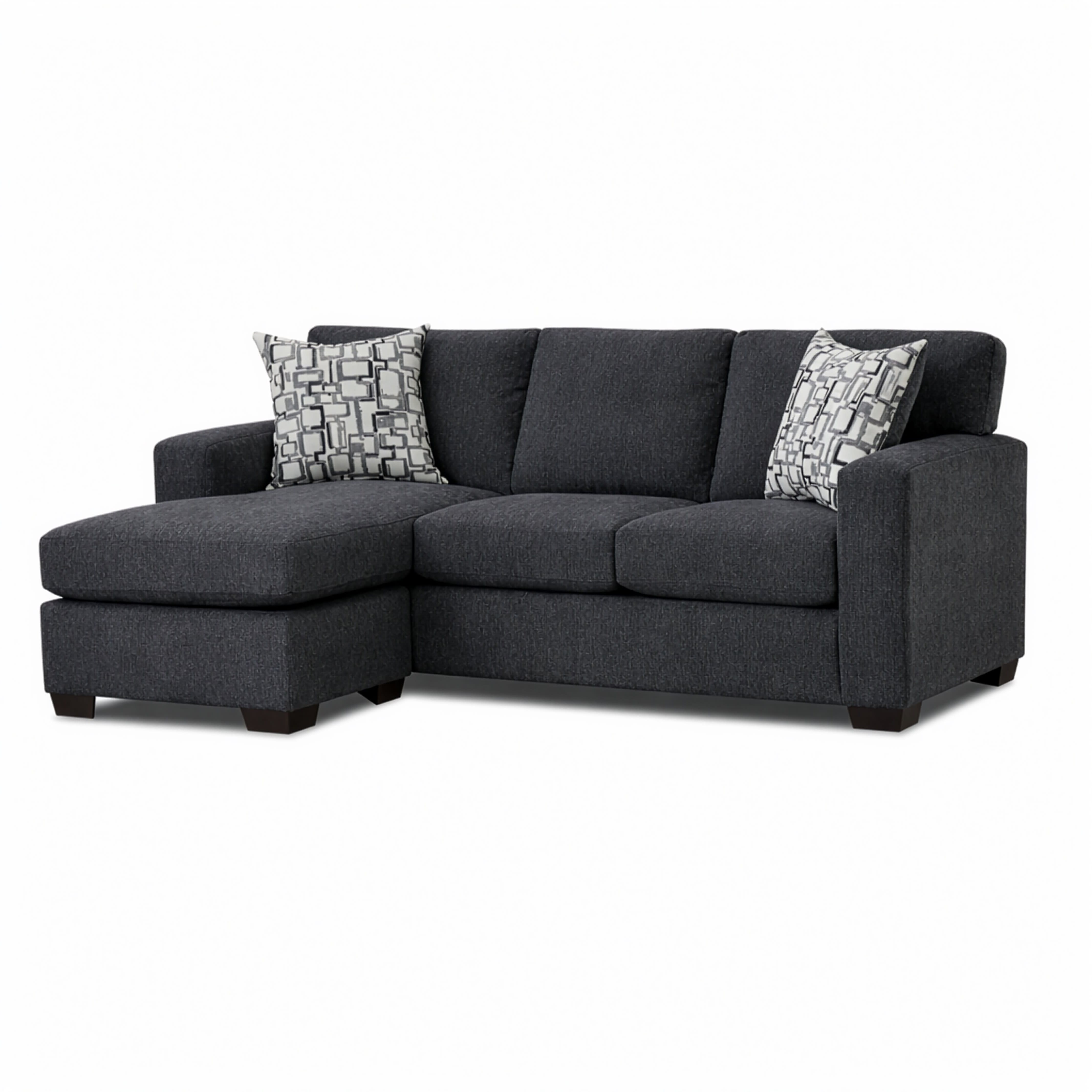 Dark gray sectional sofa with chaise and two patterned throw pillows.