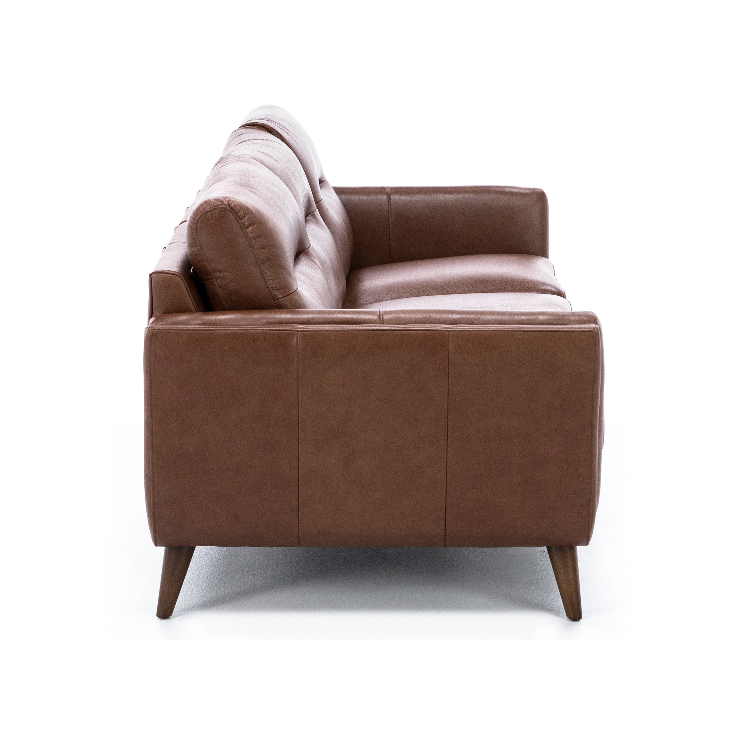 Side view of a modern brown leather sofa with wood legs on a white background.