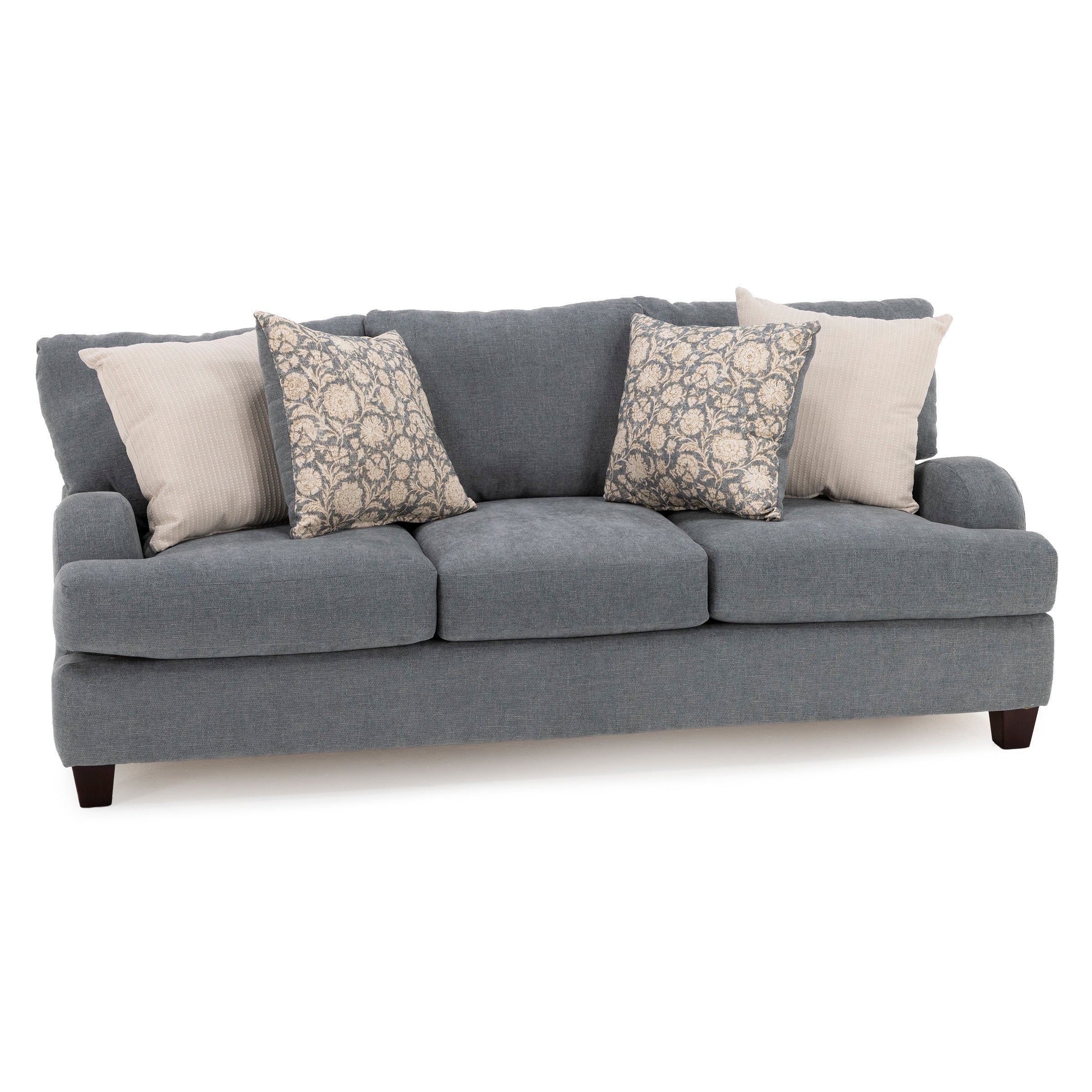 Gray upholstered sofa with three seat cushions and four decorative pillows.