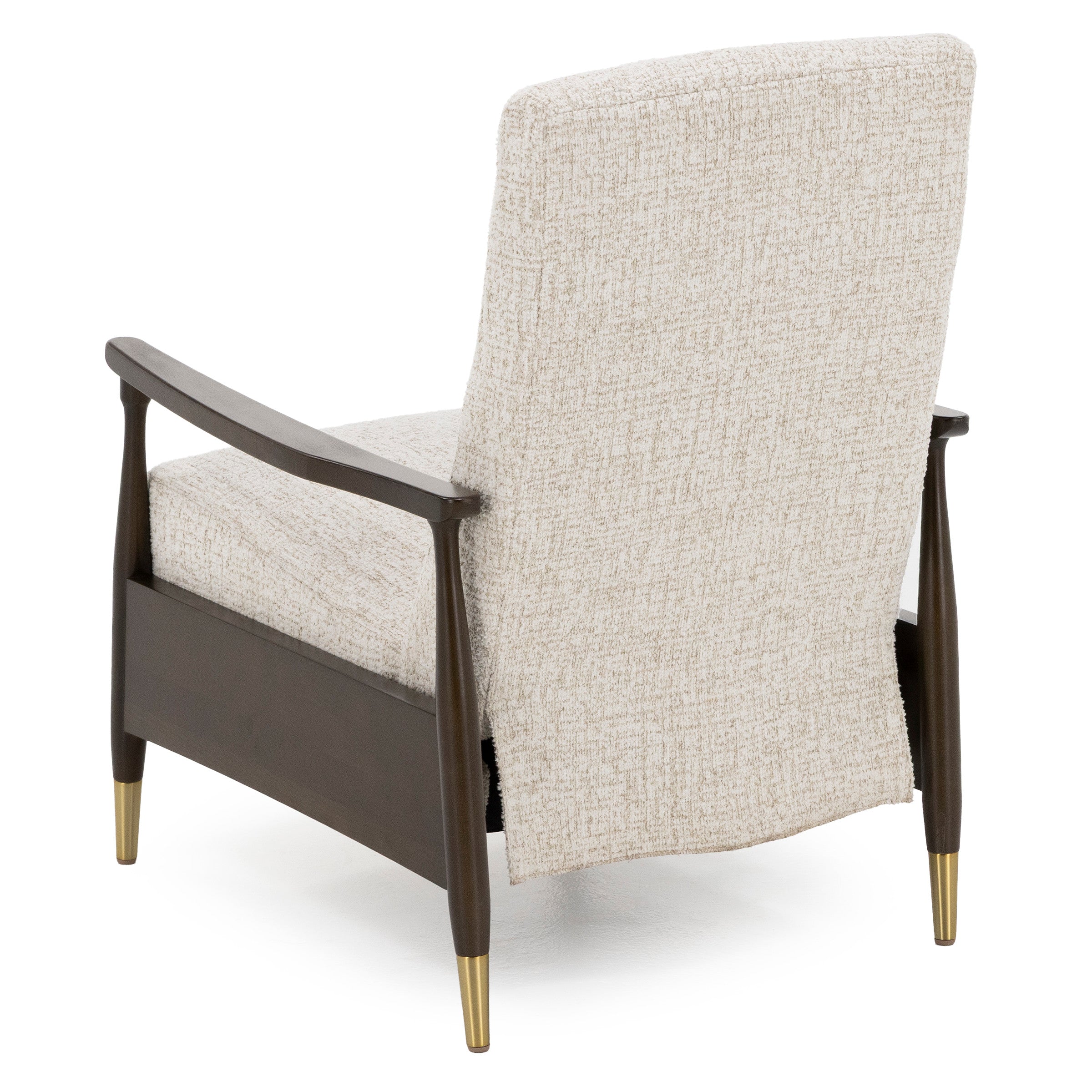 Back view of an upholstered chair with wooden frame and brass-tipped legs.