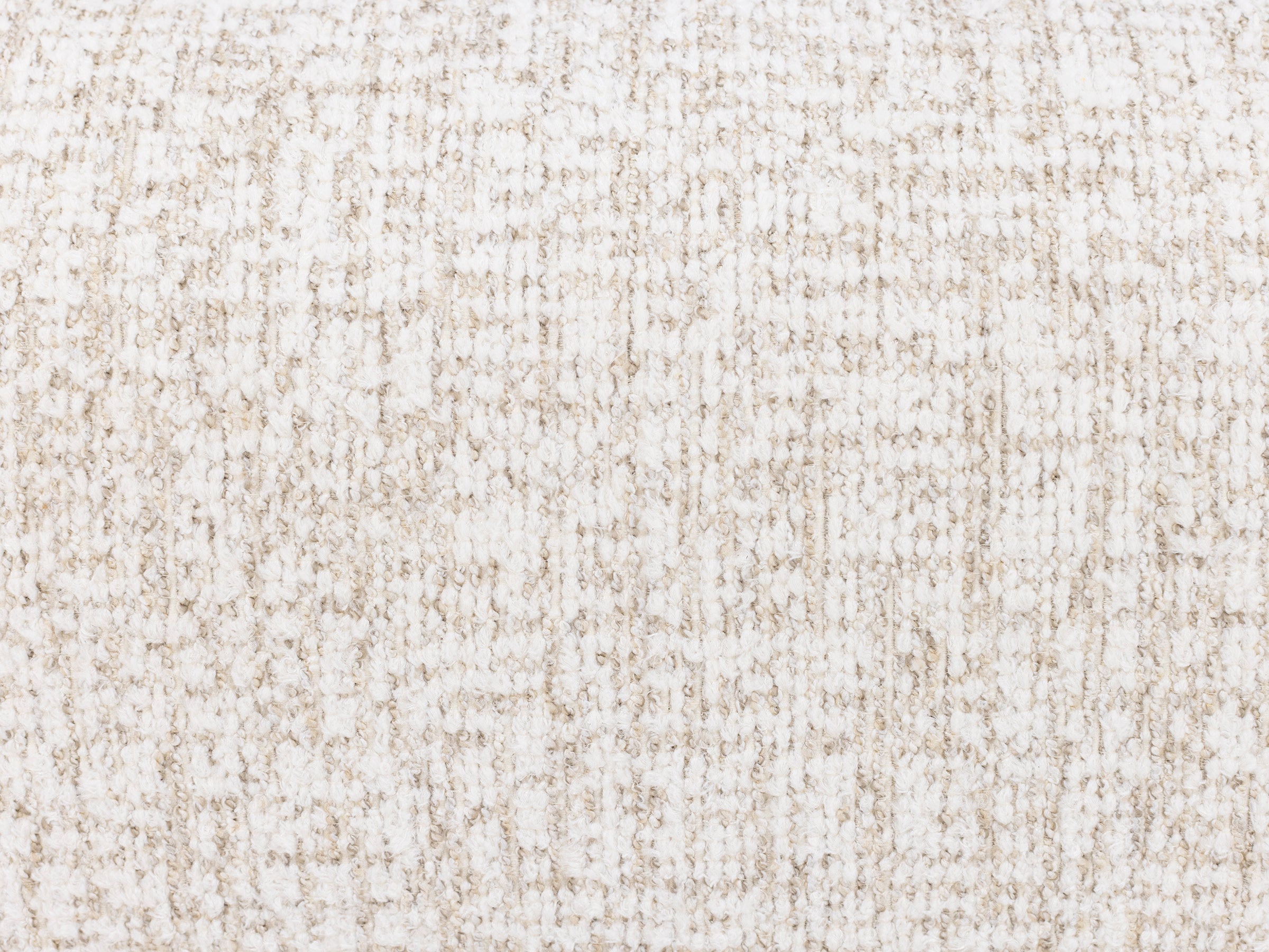 Close-up of textured beige and white woven fabric.