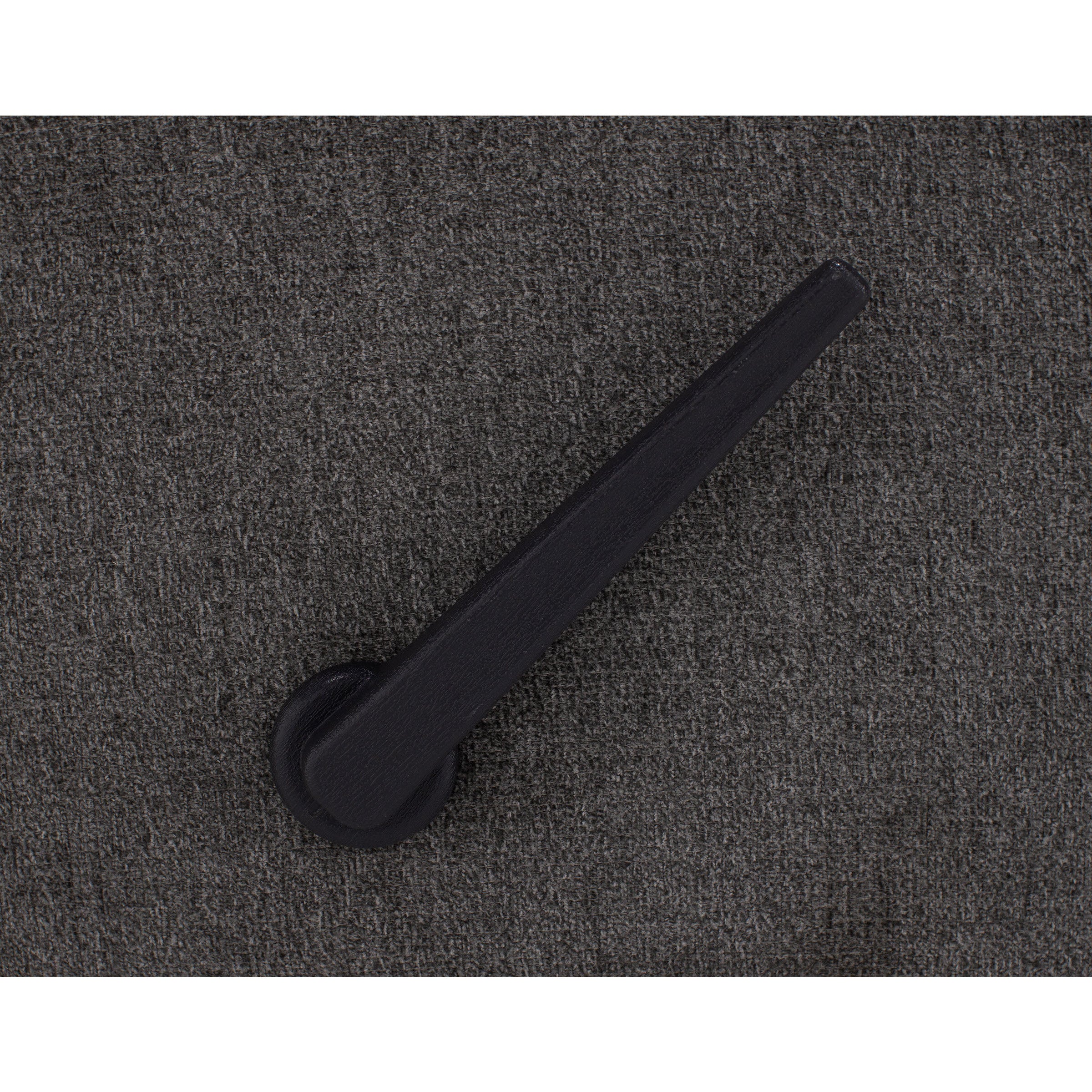 Black lever handle on textured dark gray background