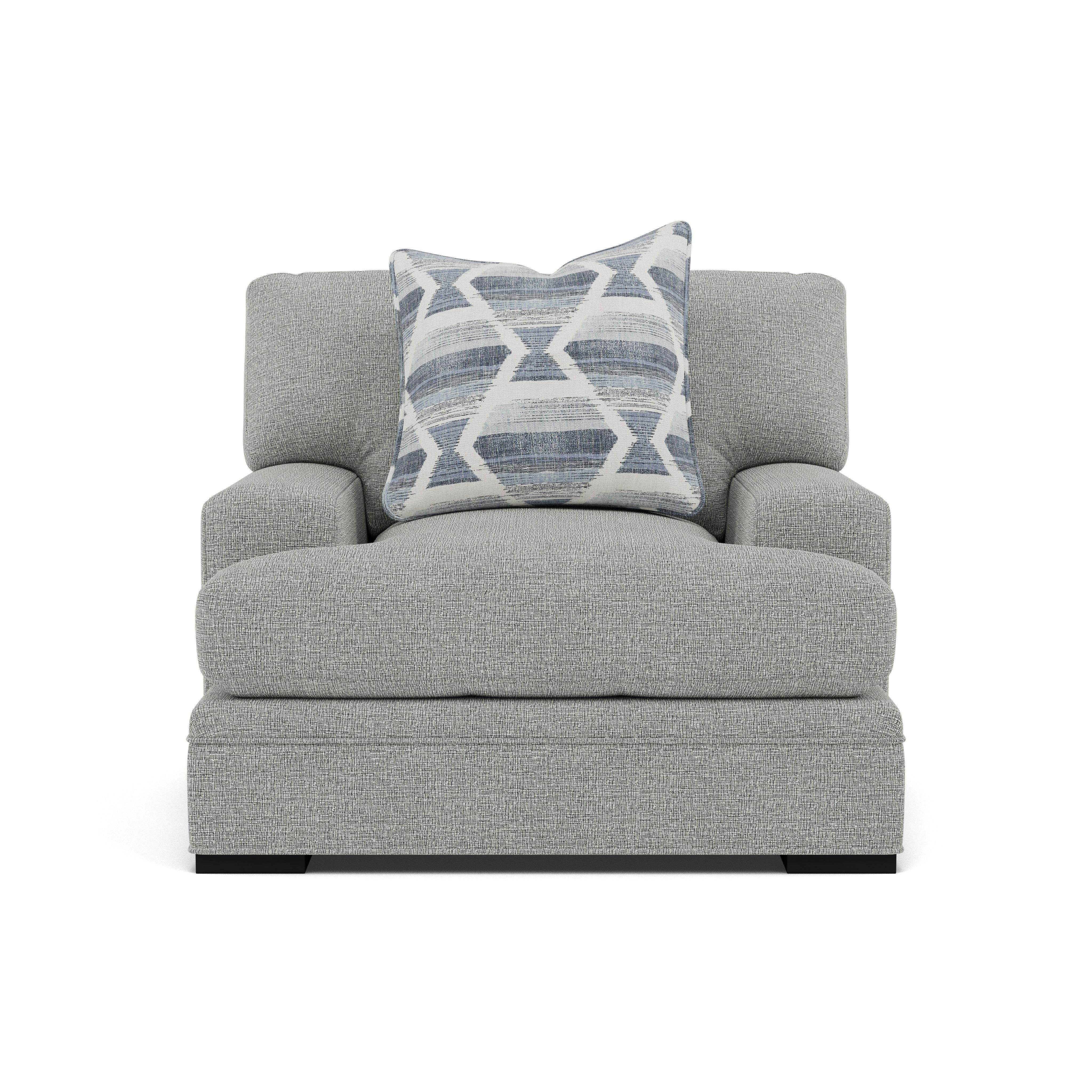 Light gray armchair with a blue and white geometric pillow, shown from the front.