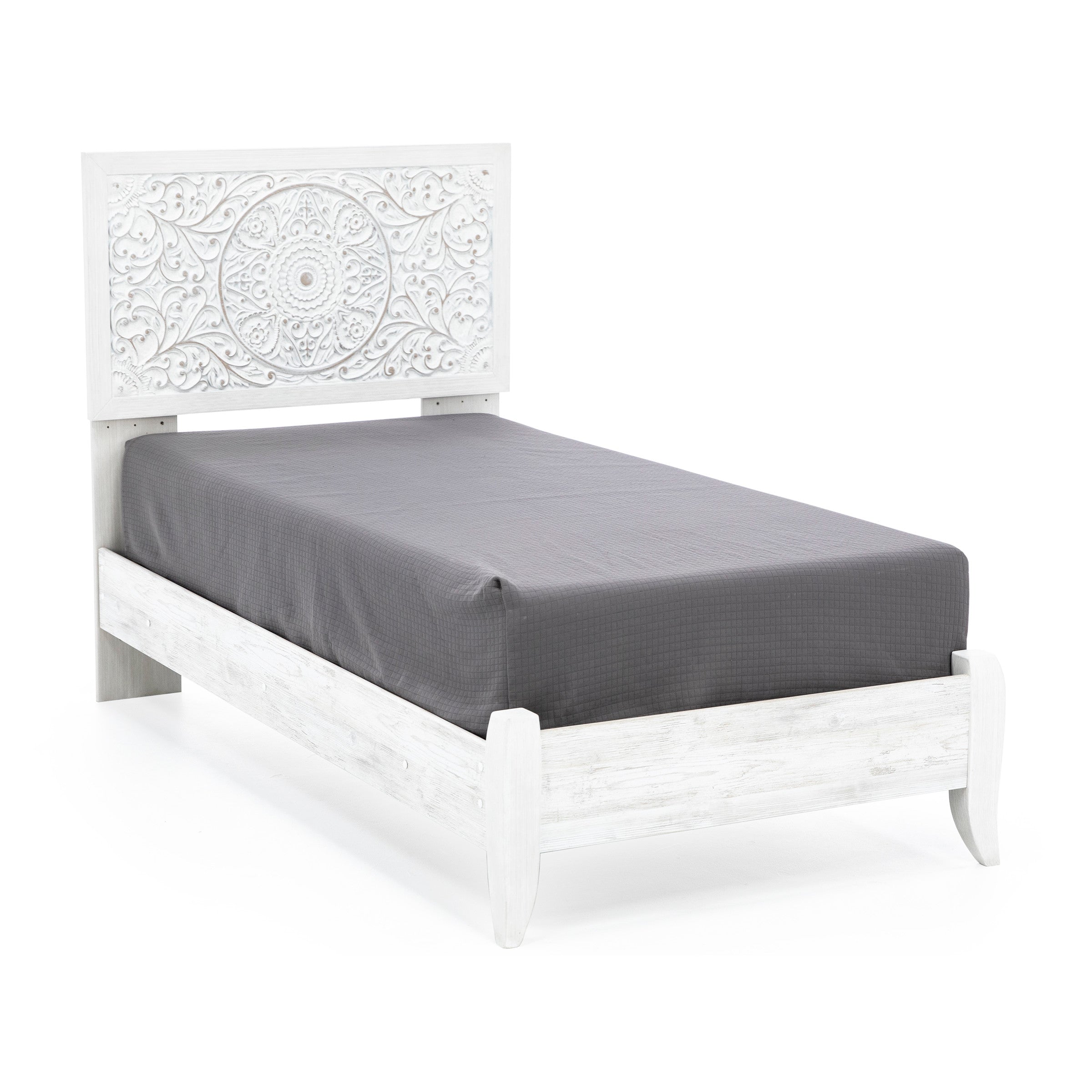 White twin bed with carved floral headboard and gray mattress, shown at an angle.