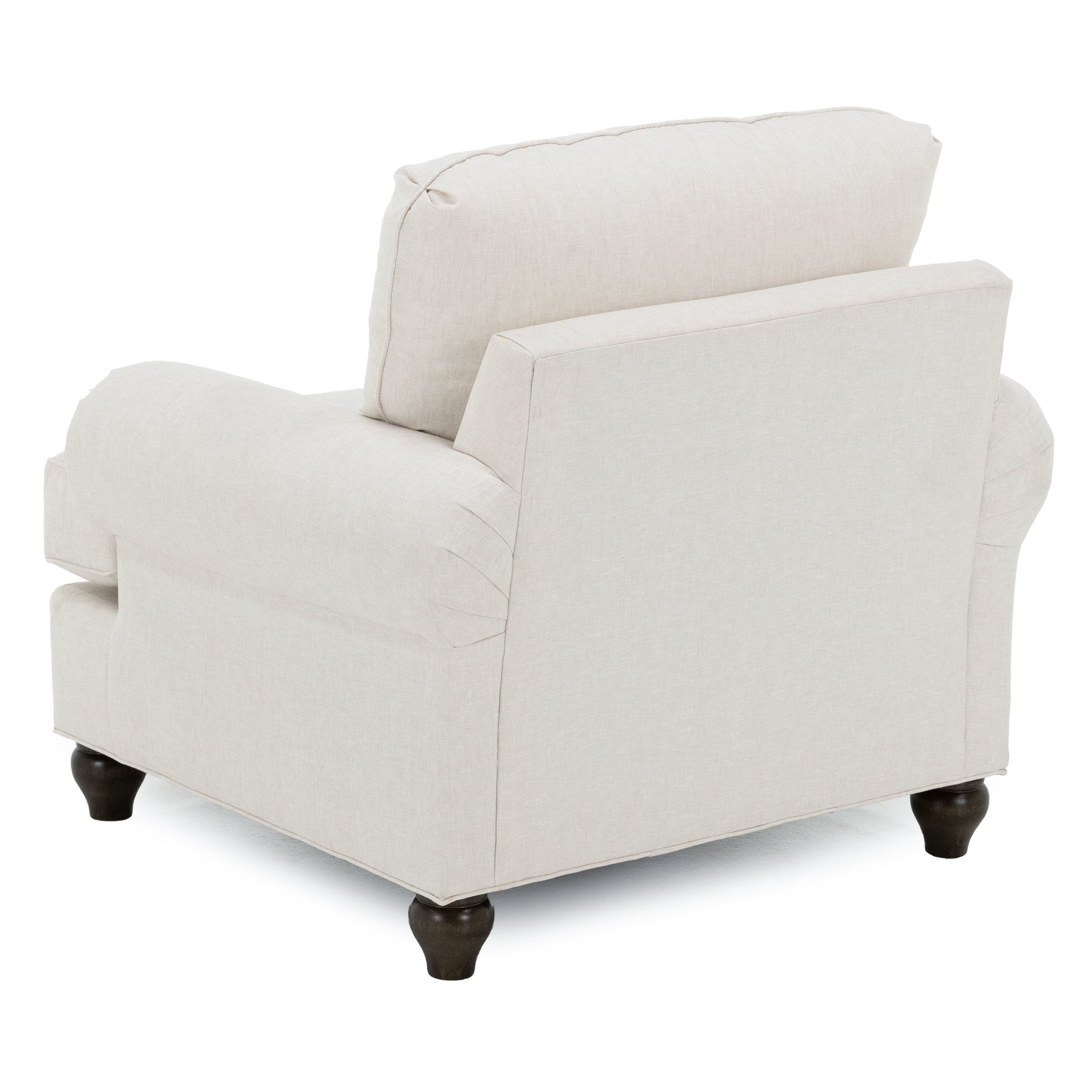 Back view of a beige upholstered armchair with dark wooden legs.