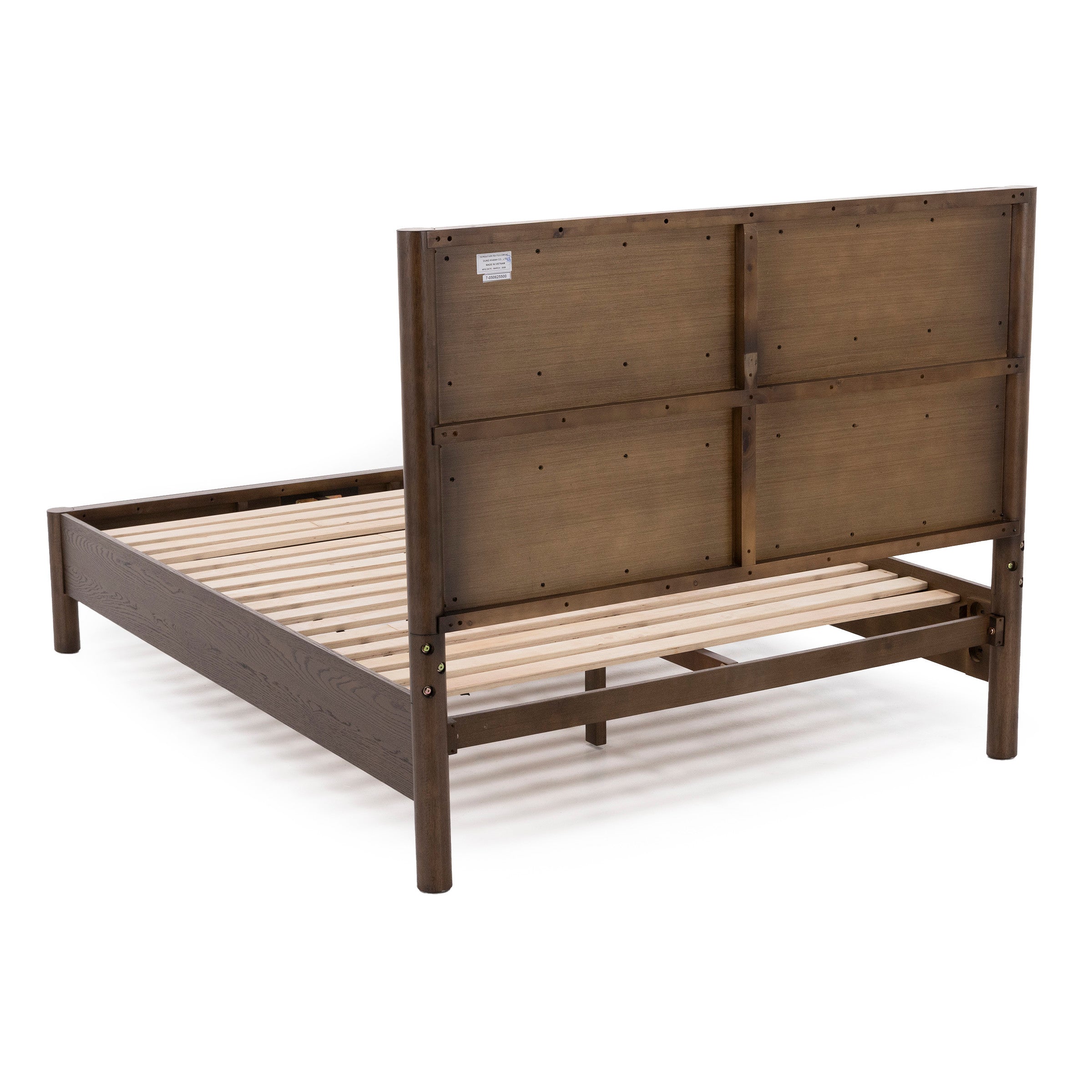 Rear view of a wooden bed frame with wide slats and a tall, flat headboard.