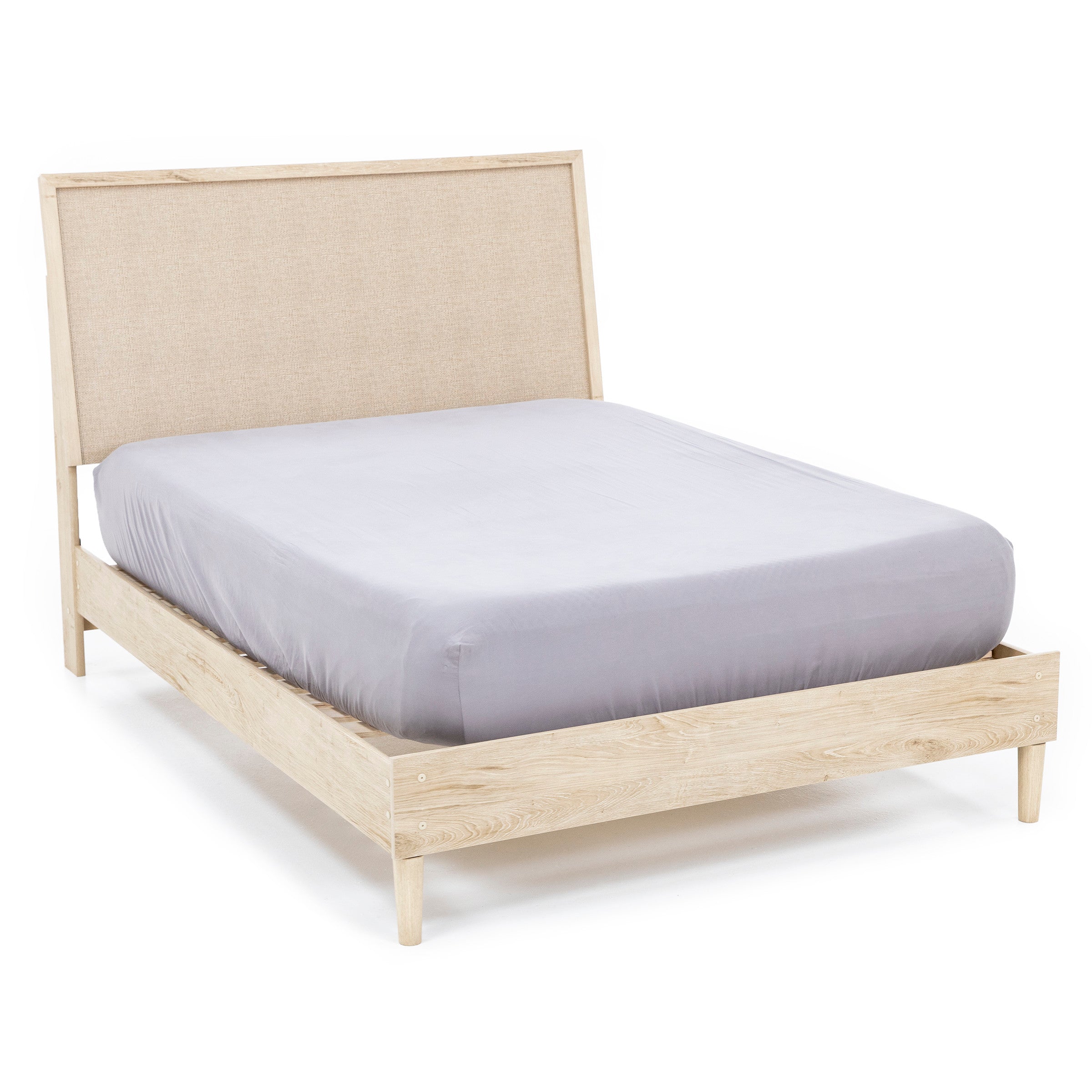 Light wood bed frame with a beige upholstered headboard and a gray mattress.