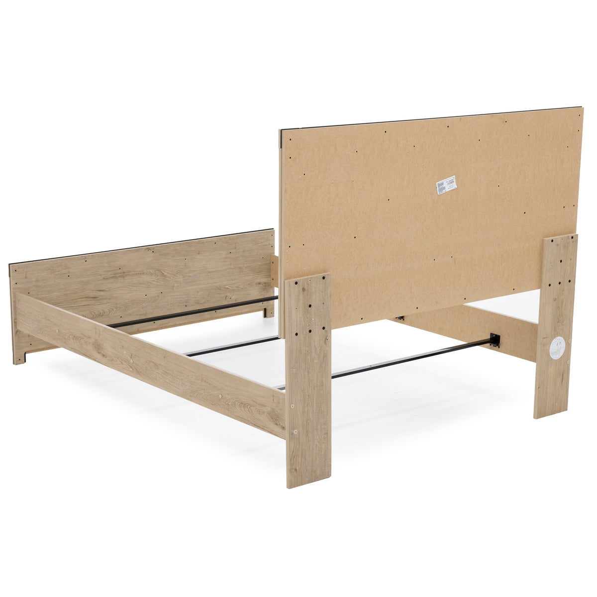 Rear view of a wooden bed frame with headboard and footboard, no mattress or bedding.