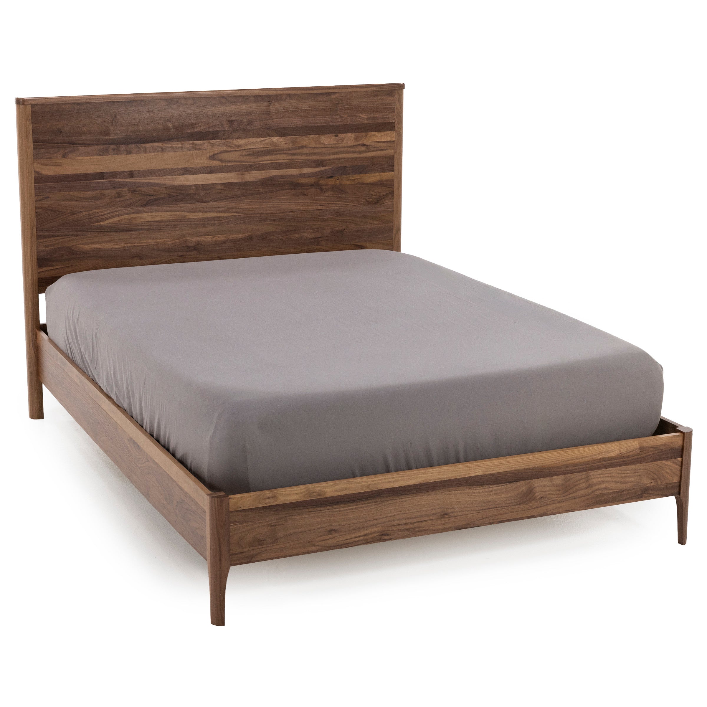 Walnut wood bed frame with a simple slatted headboard and gray mattress.
