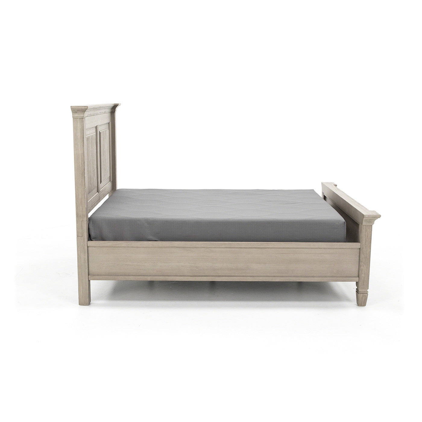 Light wood bed frame with gray mattress, viewed from the side on white background.