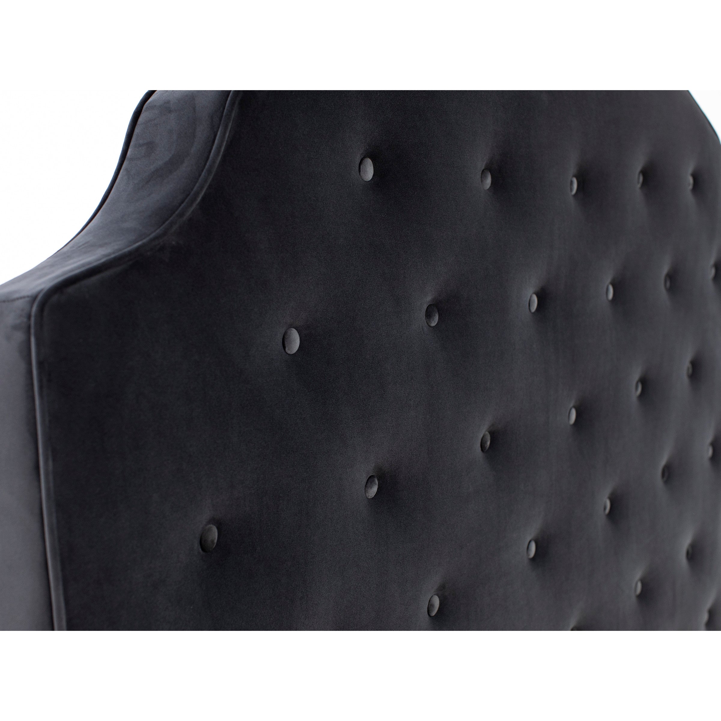 Tufted, dark upholstered headboard with soft, curved top.