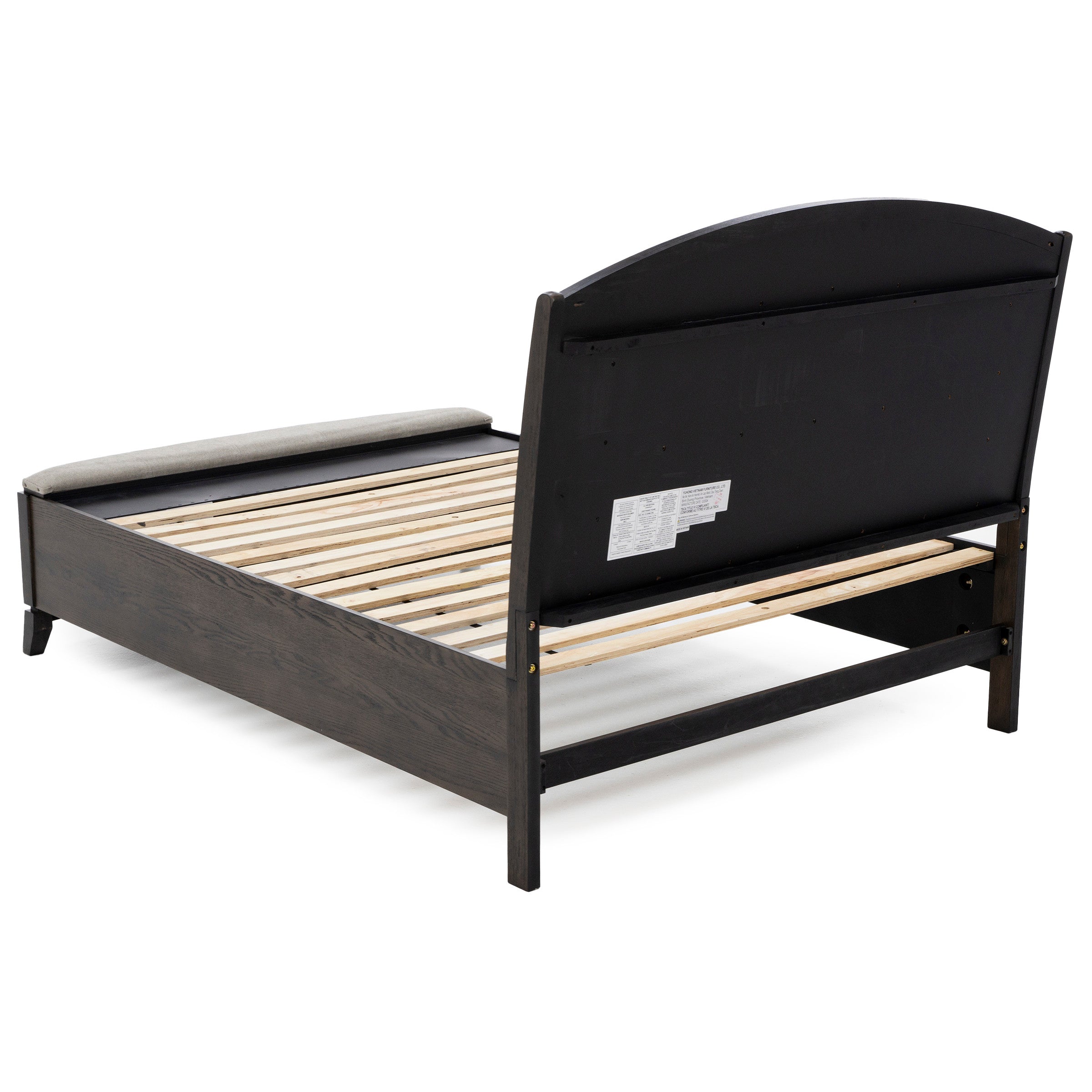 Wooden bed frame with slatted base and upholstered headboard, shown from the back corner.