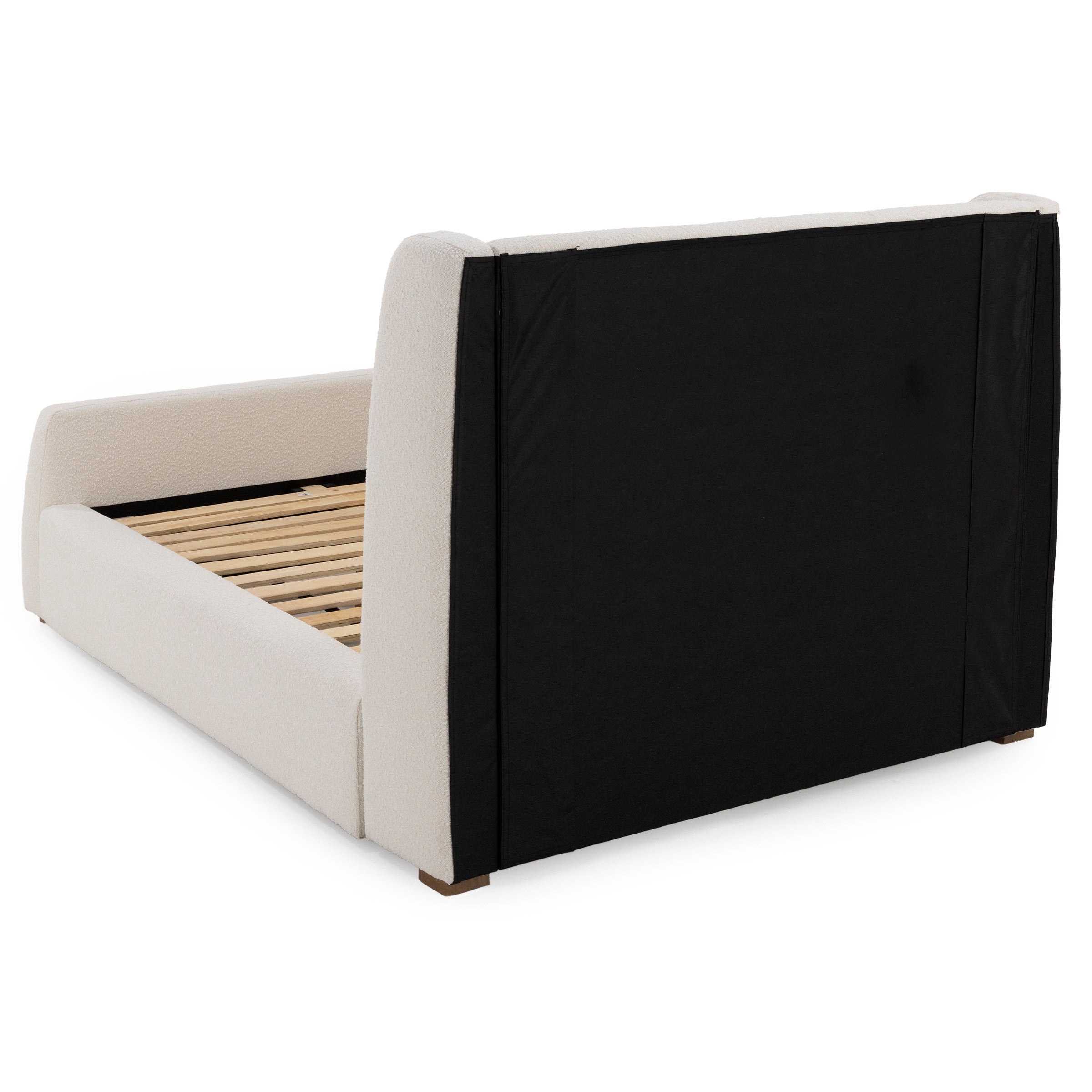 Rear angle view of a modern upholstered bed frame with wooden slats.
