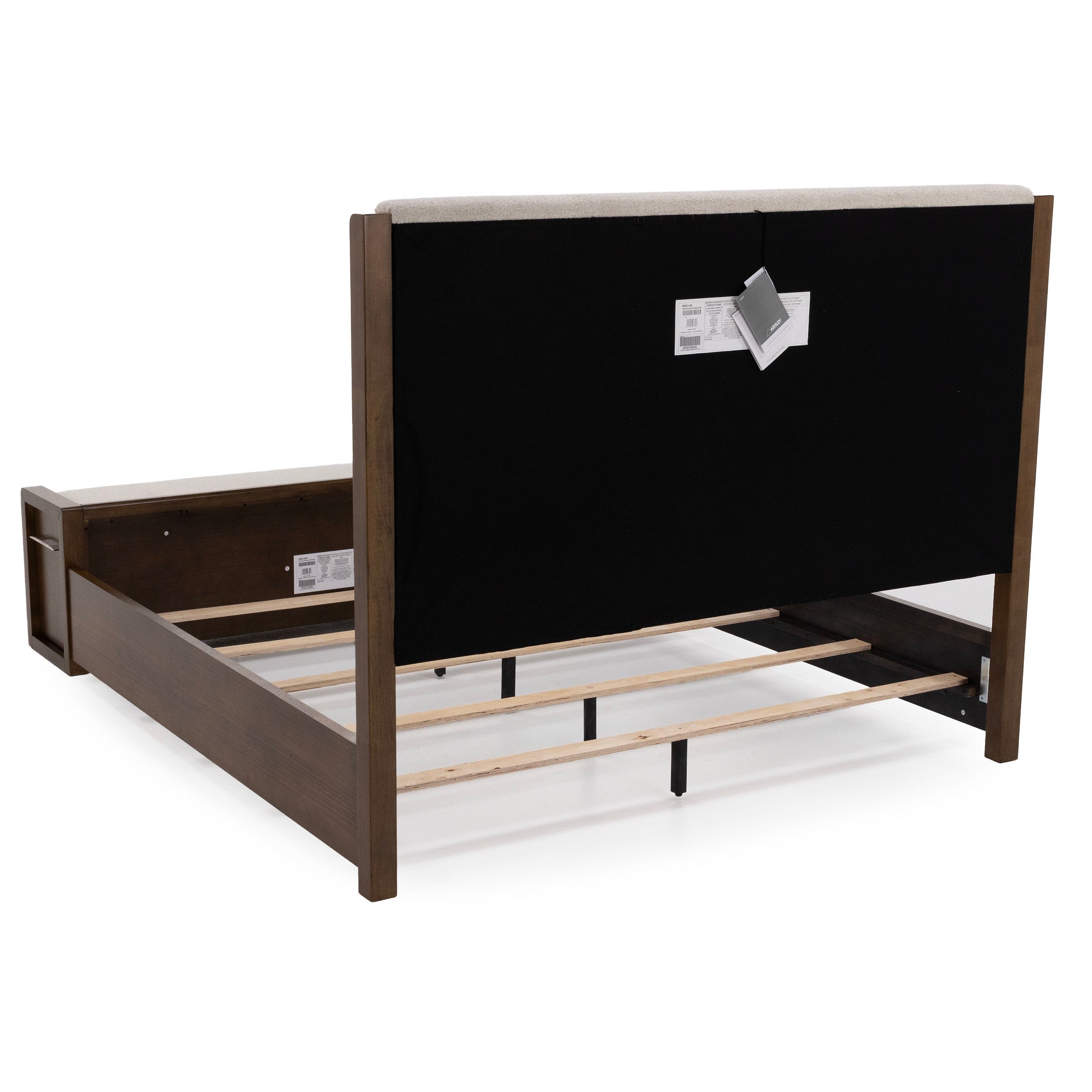 Rear view of a wooden bed frame with headboard and support slats, photographed on a white background.