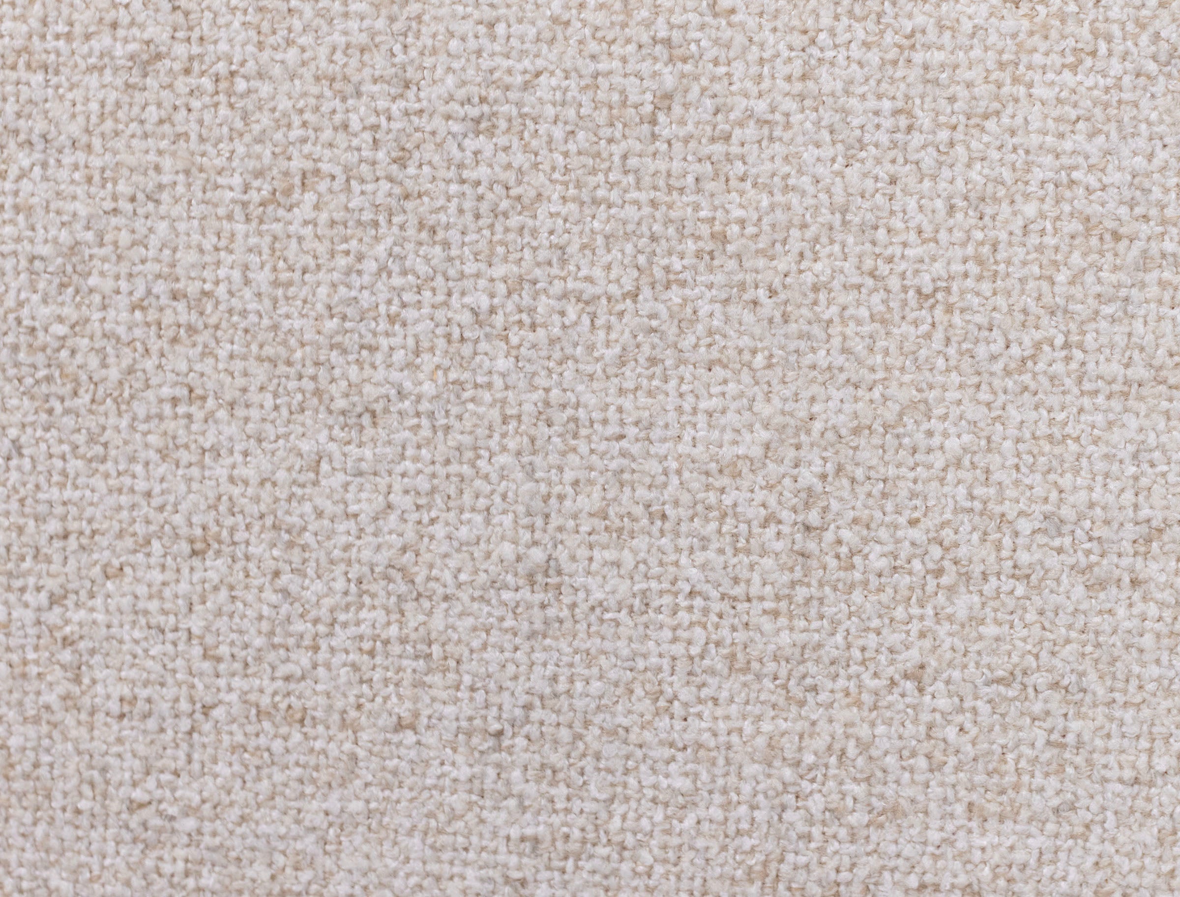 Close-up of beige textured carpet fabric.