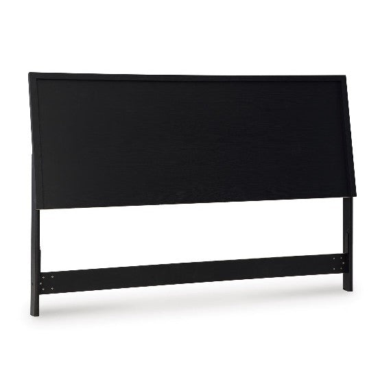 Black wooden headboard with simple, modern design.