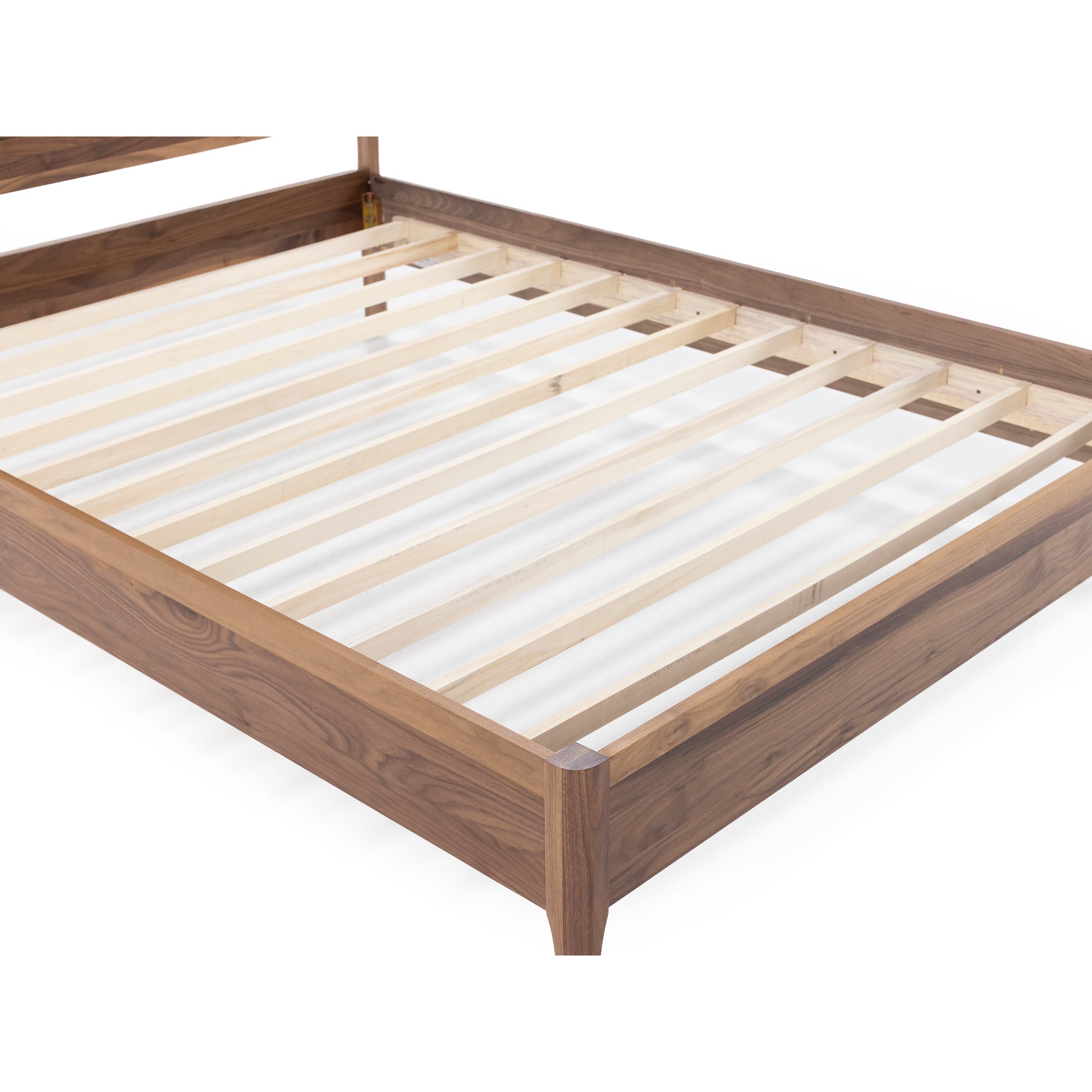 Wooden bed frame with evenly spaced slats, viewed from the corner.
