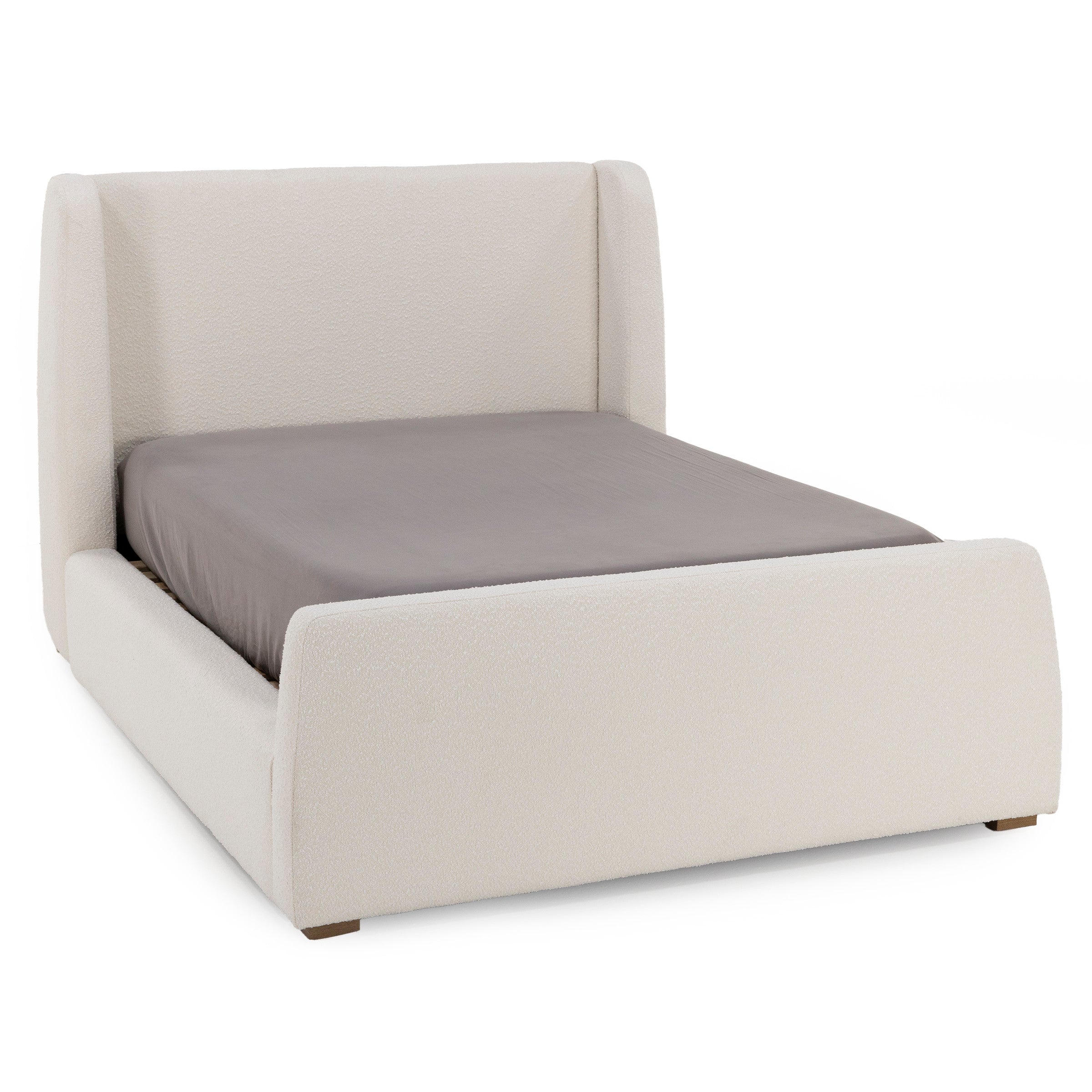 Modern platform bed with cream-colored upholstered frame and a gray mattress.