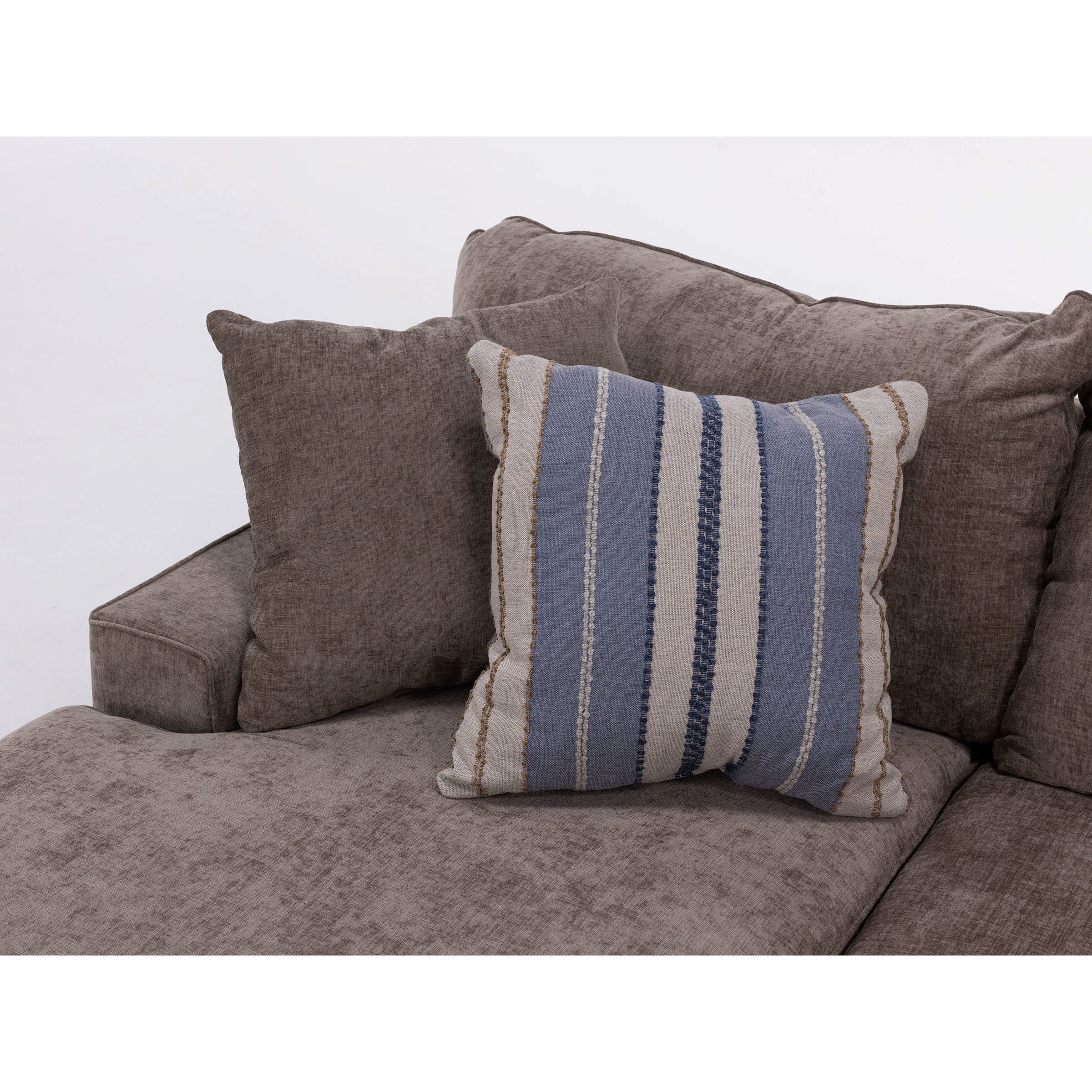 Gray sofa with decorative pillows, including one with blue and white stripes.