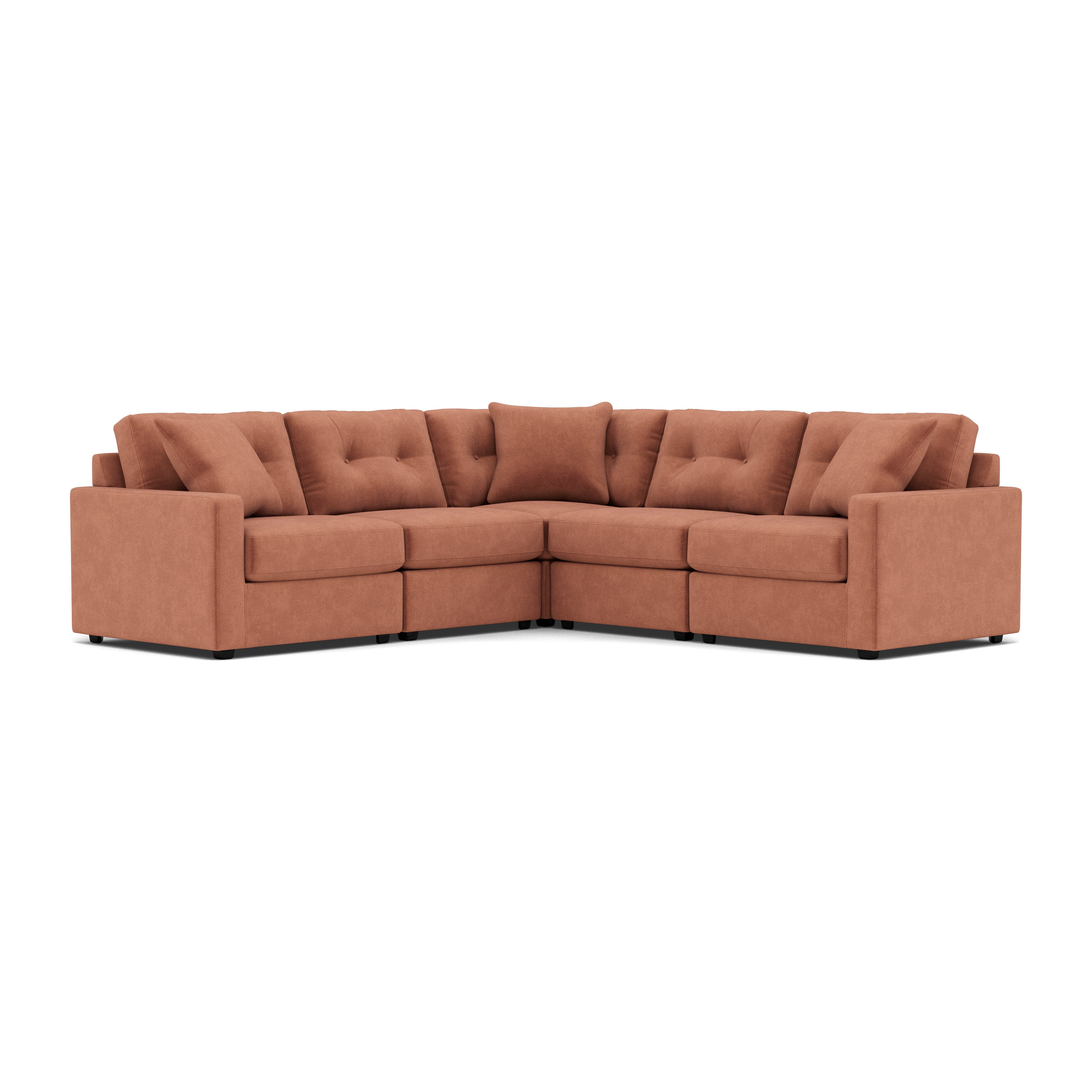 Modular L-shaped sectional sofa with tufted cushions in rust fabric.