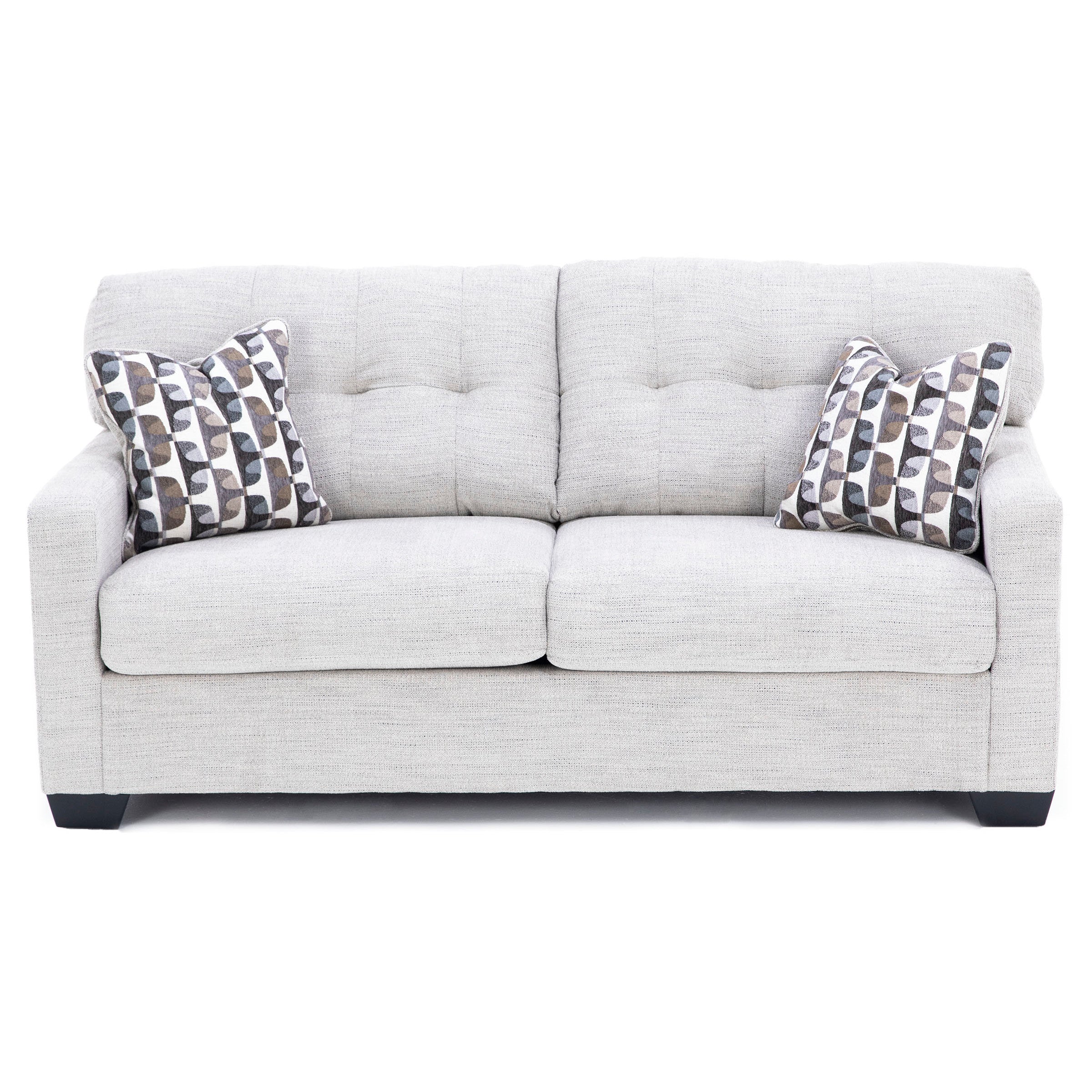 Light gray sofa with geometric patterned pillows, front view.