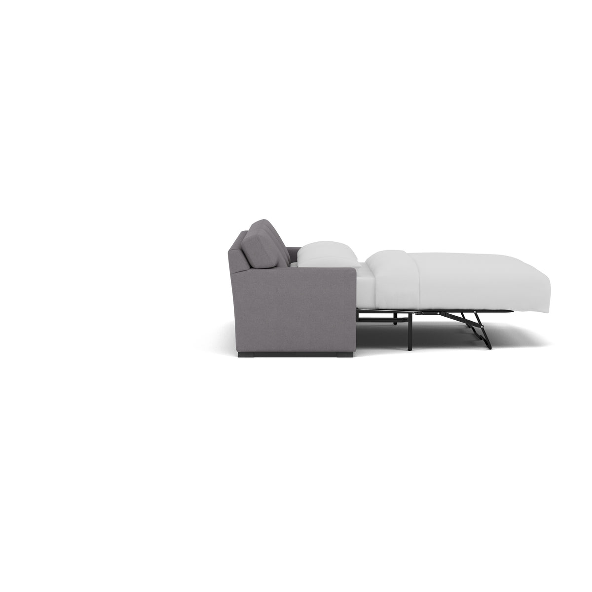 Side view of a gray sleeper sofa extended into a bed with white bedding.