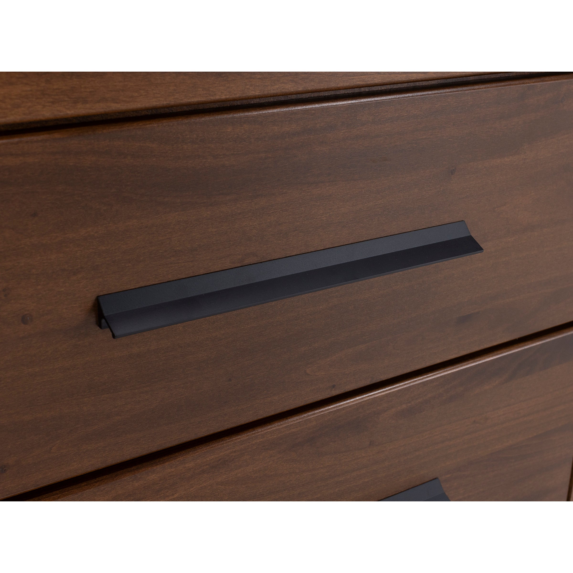 Close-up of a wooden drawer with a modern black handle.