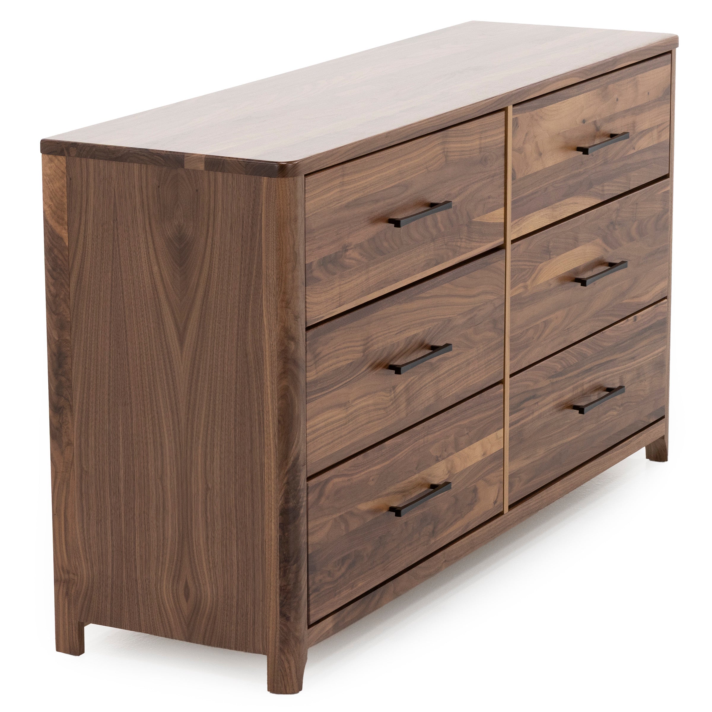 Walnut dresser with six drawers and black handles, angled view.