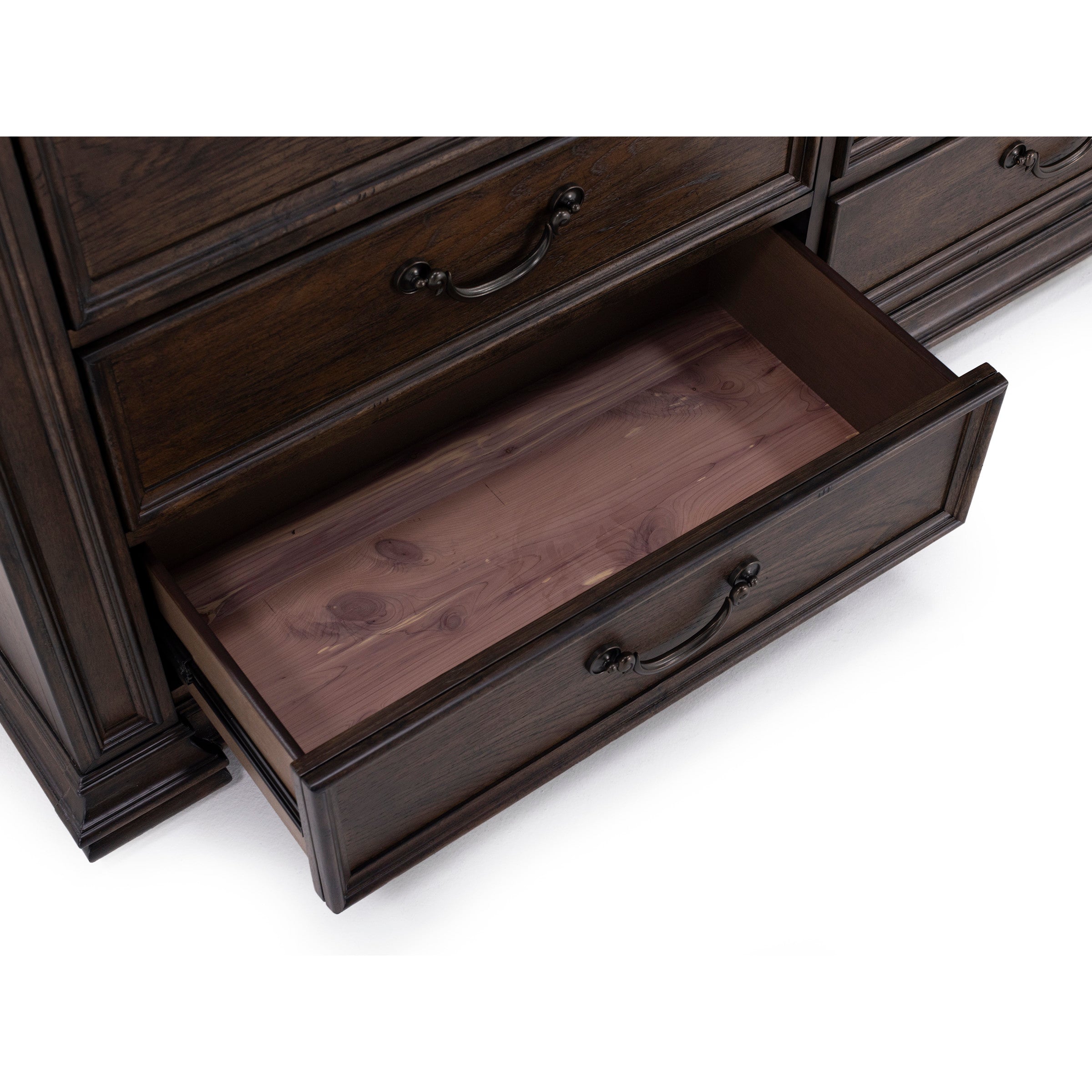 Open dresser drawer showing cedar-lined interior and dark wood finish.