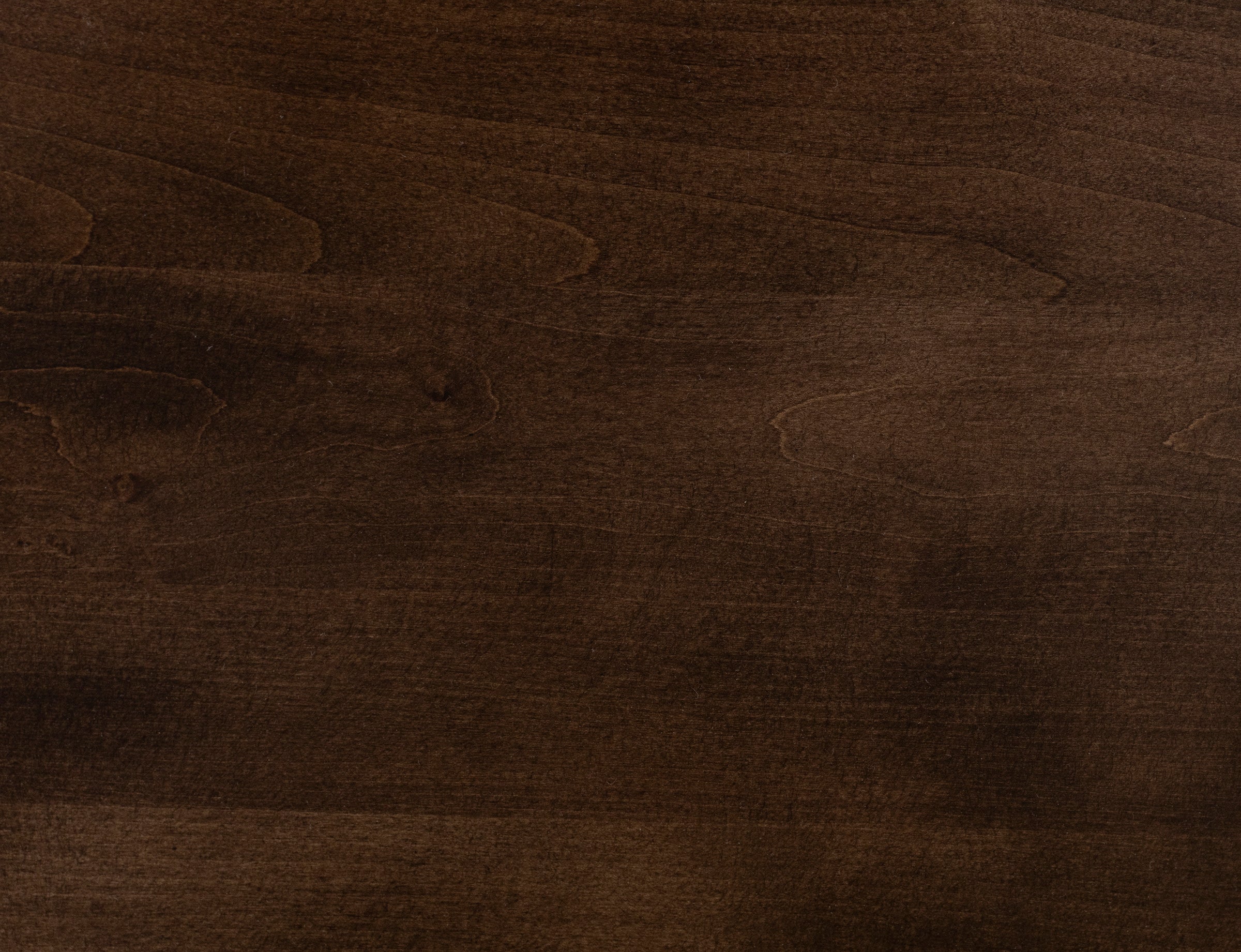 Dark brown wood texture with visible grain.