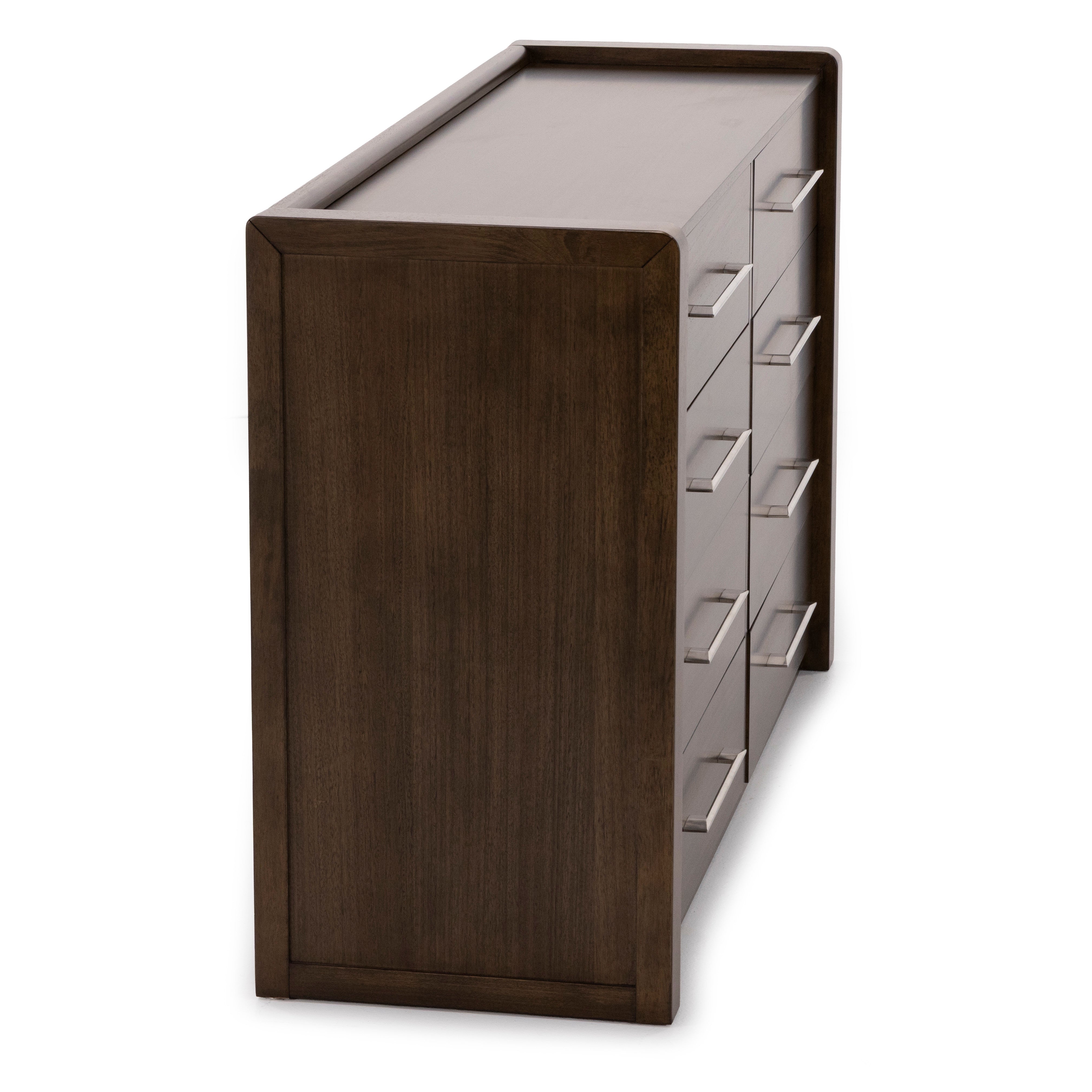 Side view of a dark wood dresser with metal handles on drawers.