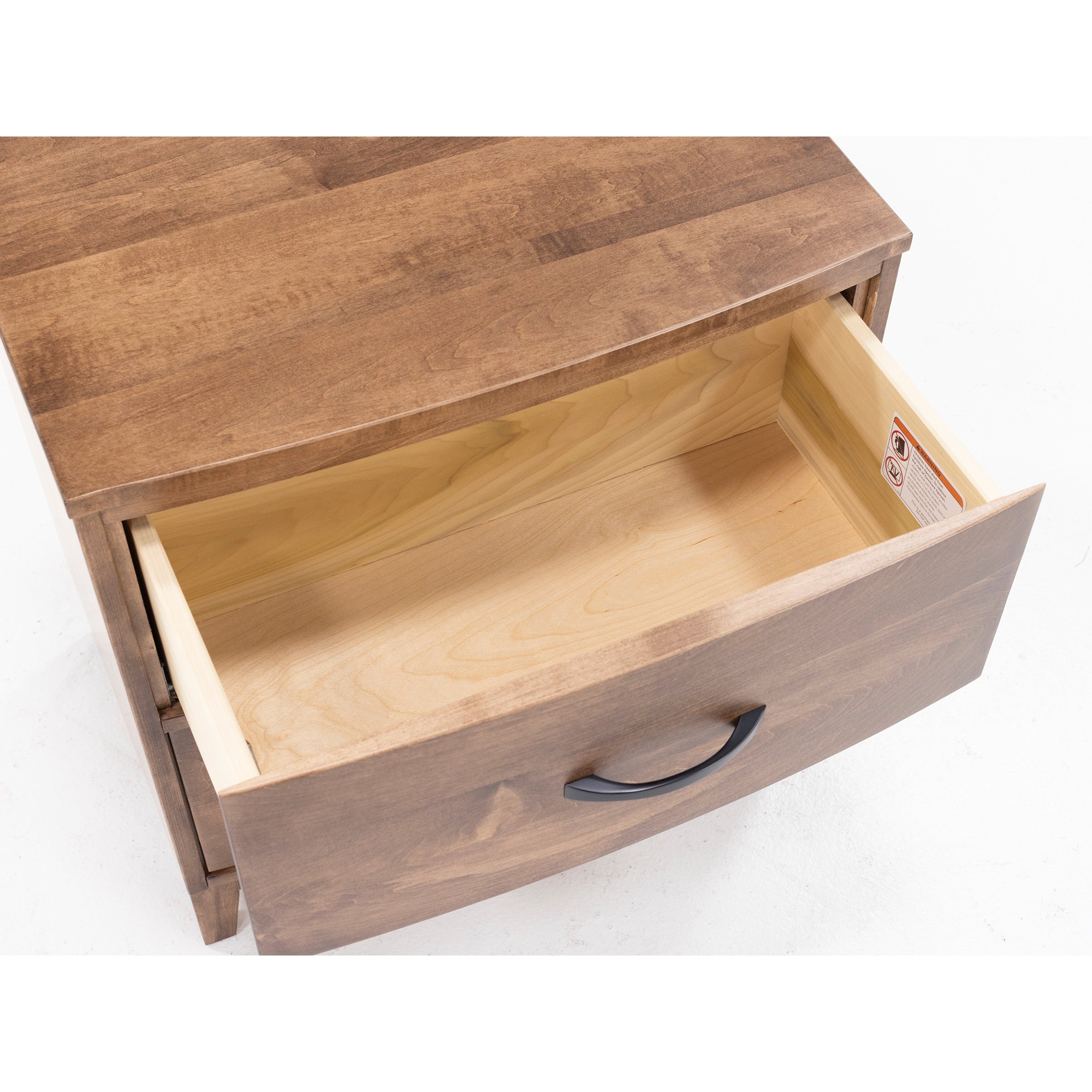 Open wooden drawer in a dresser, showing interior and handle.