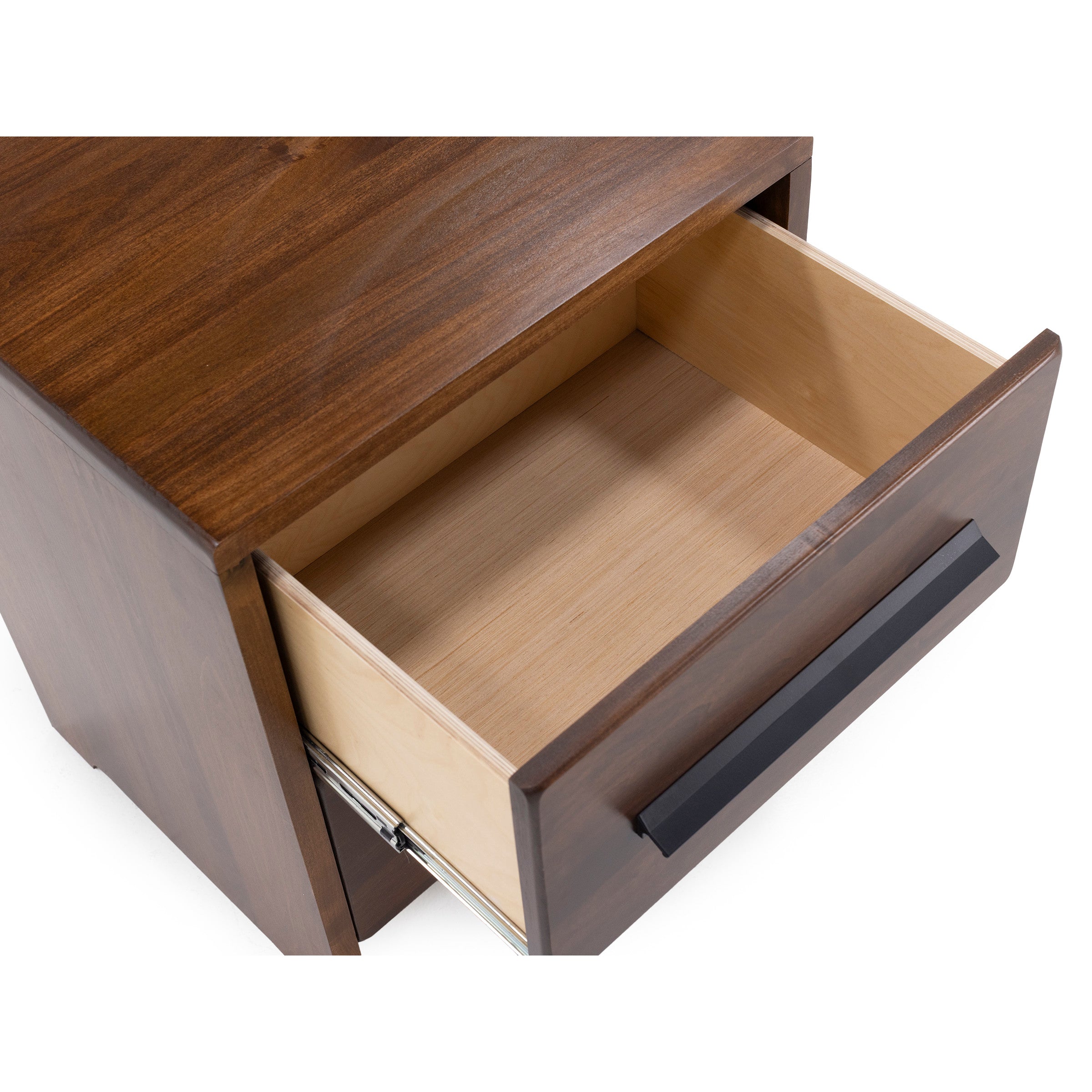 Open top drawer of a wooden nightstand with a black handle.