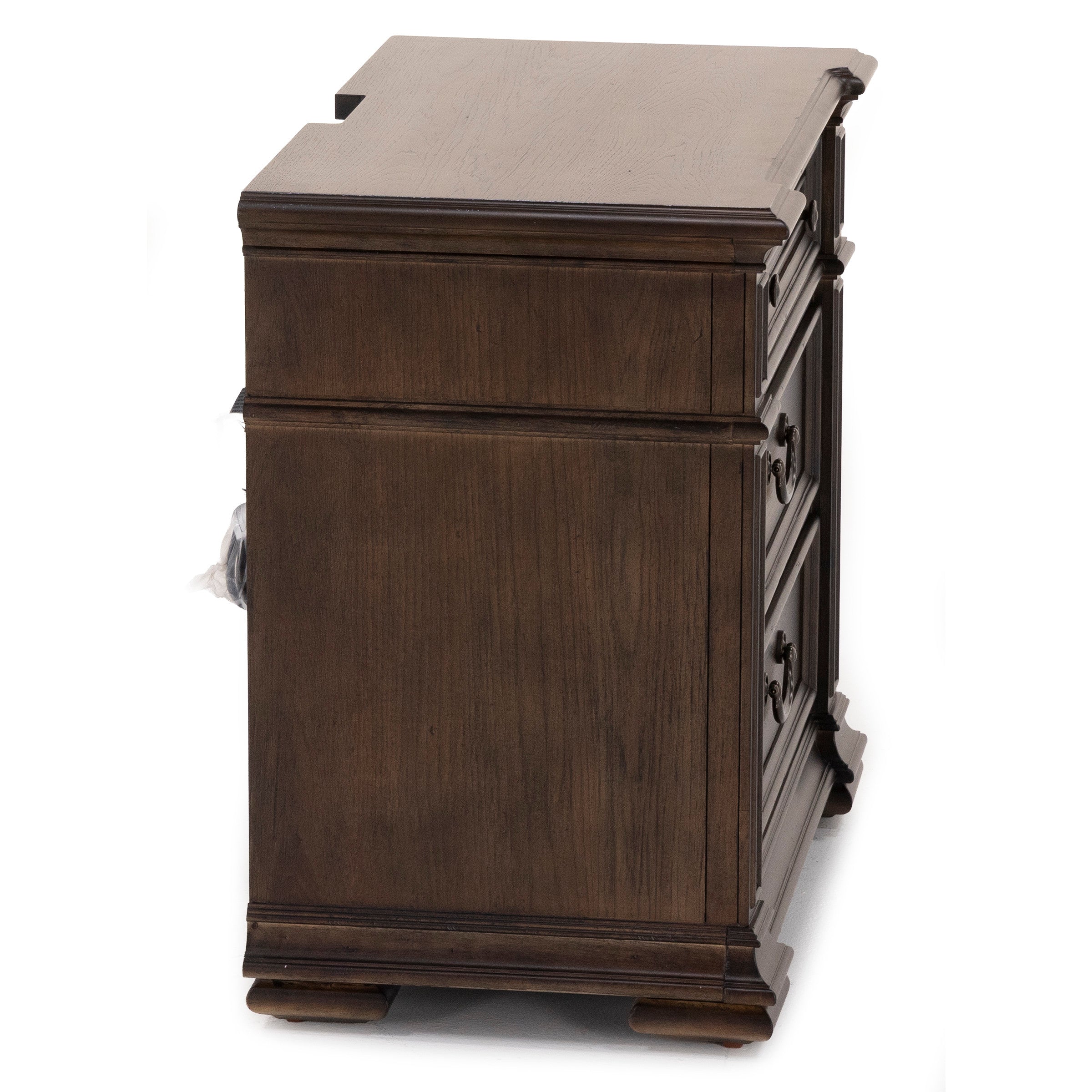 Side view of a dark wood file cabinet with decorative trim and metal drawer handles.